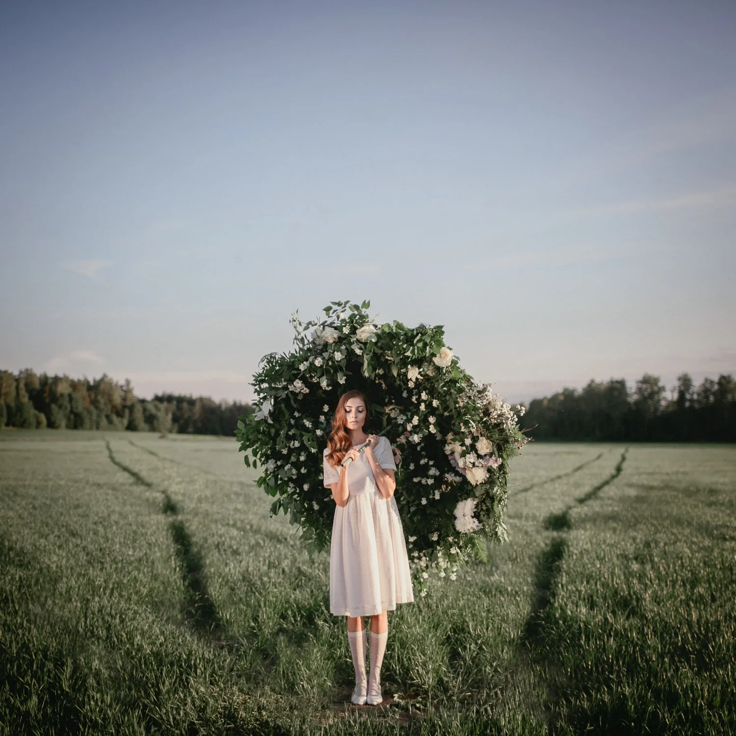  
 Title: 
 
Flower Doors 
 Story & Message:   
The grass caressed her feet until she could barely remember what bothered her in the first place. She knew it had something to do with the chitter-chatter of the village girls that seemed to gossip abou