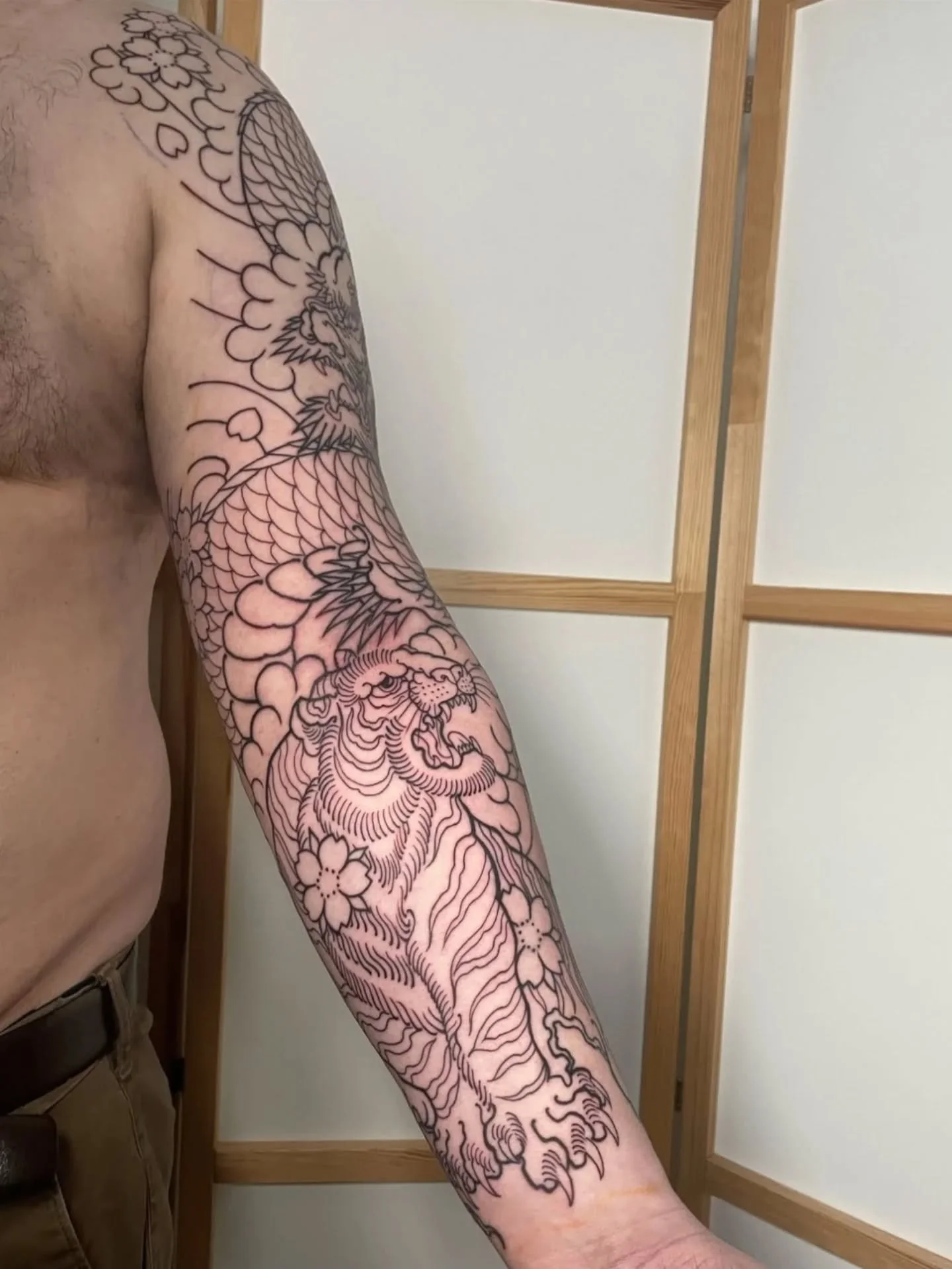 Great start on this tiger and dragon sleeve for Dan! 🐅🐉- Done by @dannywildhorses 

If you're interested in getting some large-scale Japanese tattoos like a sleeve, chest or back-piece then get in touch to discuss your ideas! 

📍Wild Horses Tattoo
