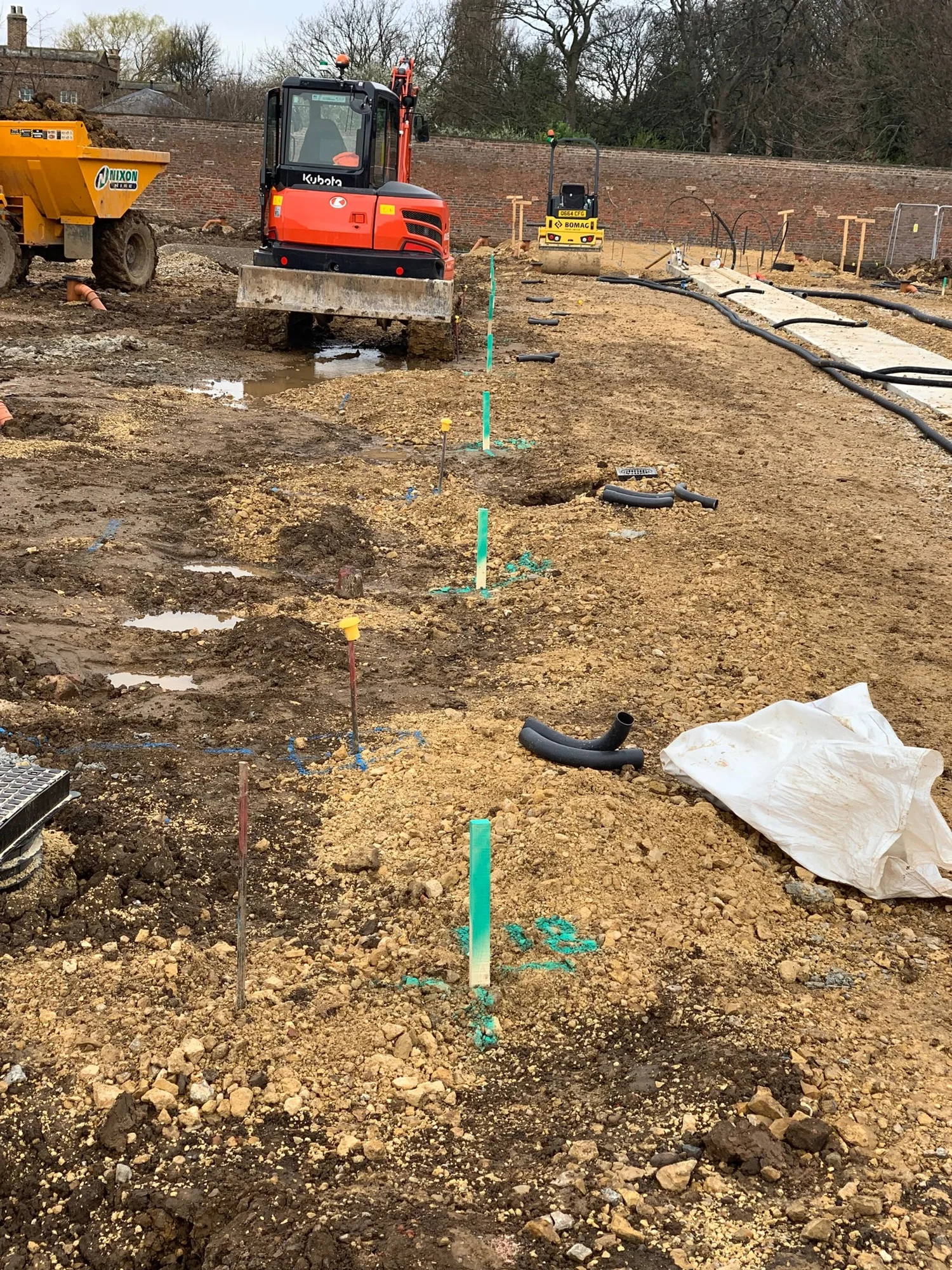 Setting out in Newcastle &mdash; pegs and profiles staked out across a groundworks site