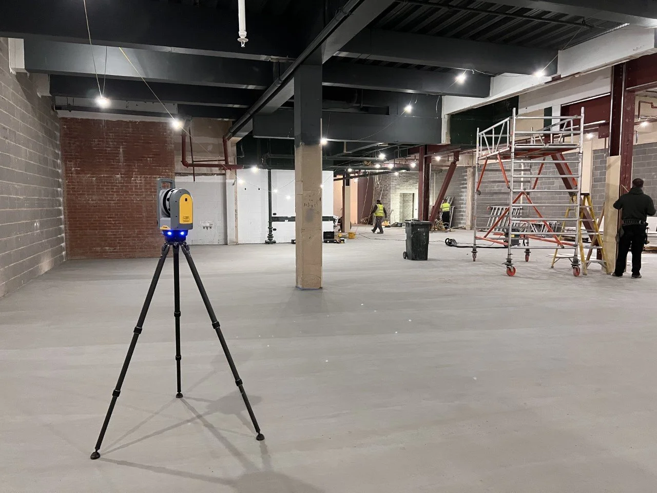 Floor flatness survey in Sunderland &mdash; laser scanner set up on a screeded floor
