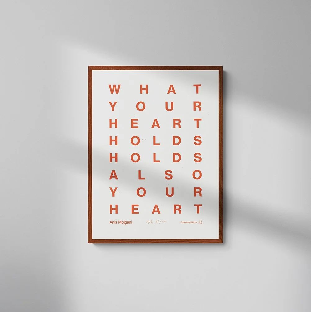 Anis_HoldsHeart_simple_wall_SQ.jpeg