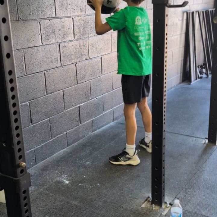 Rx'ing movements coming soon... It's not always the goal to Rx a movement loading  exactly as written or workout for our kids classes, but it's fun to mark progress along the way. The video shows that kids version of fight gone bad after developing s
