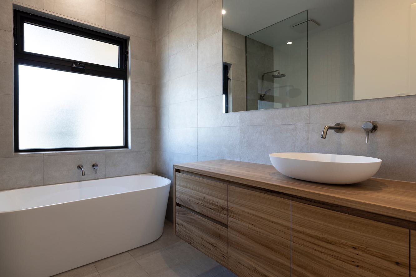 Solid timber and blackbutt veneer floating vanities designed, built and installed for a recent @spicerbuilding project. Love the finished result 🔥

#bycoastalgrain #coastalgrainjoinery #timbervanity #vanity #bathroom #build #surfcoast