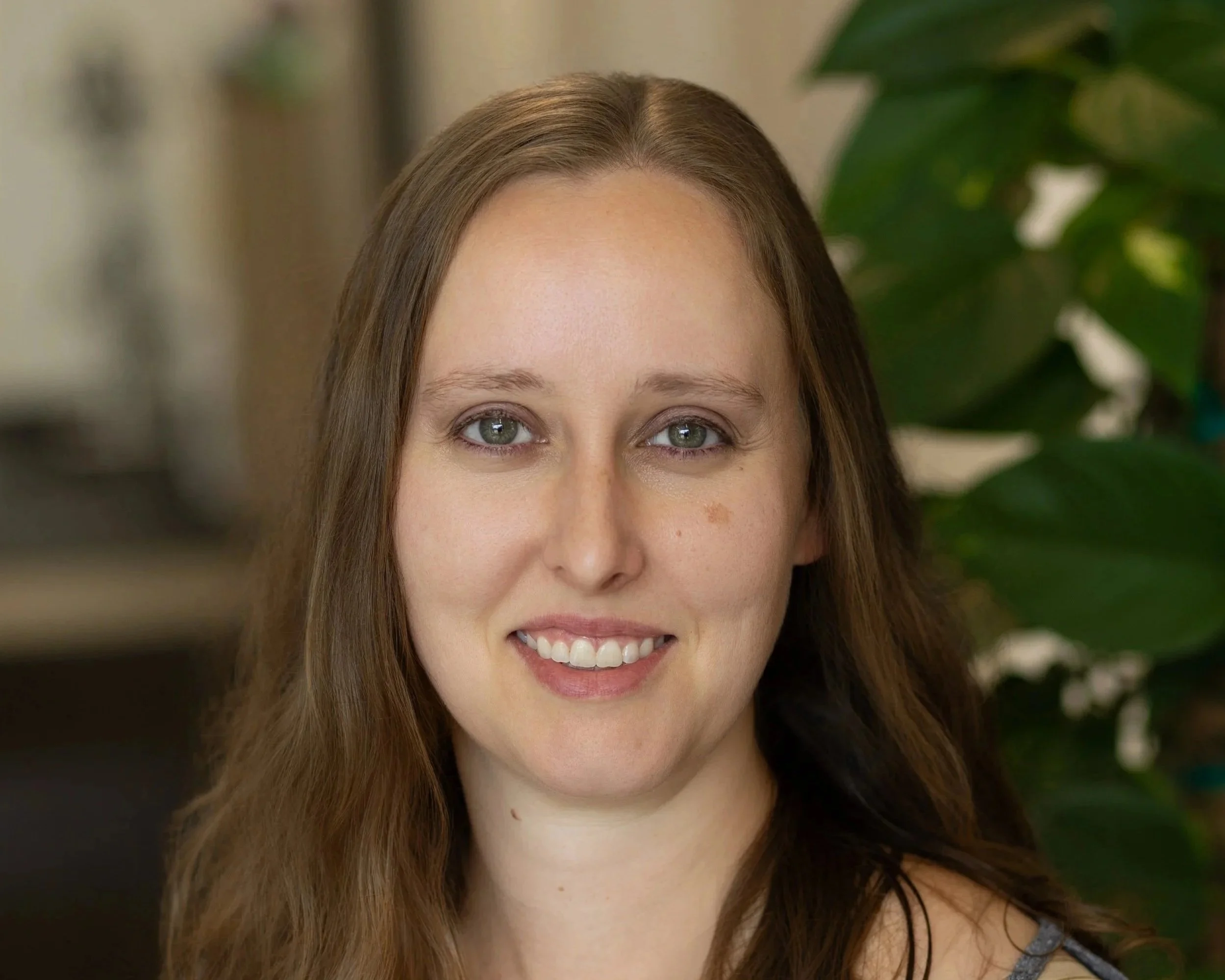 Woman with short hair and white sweater
