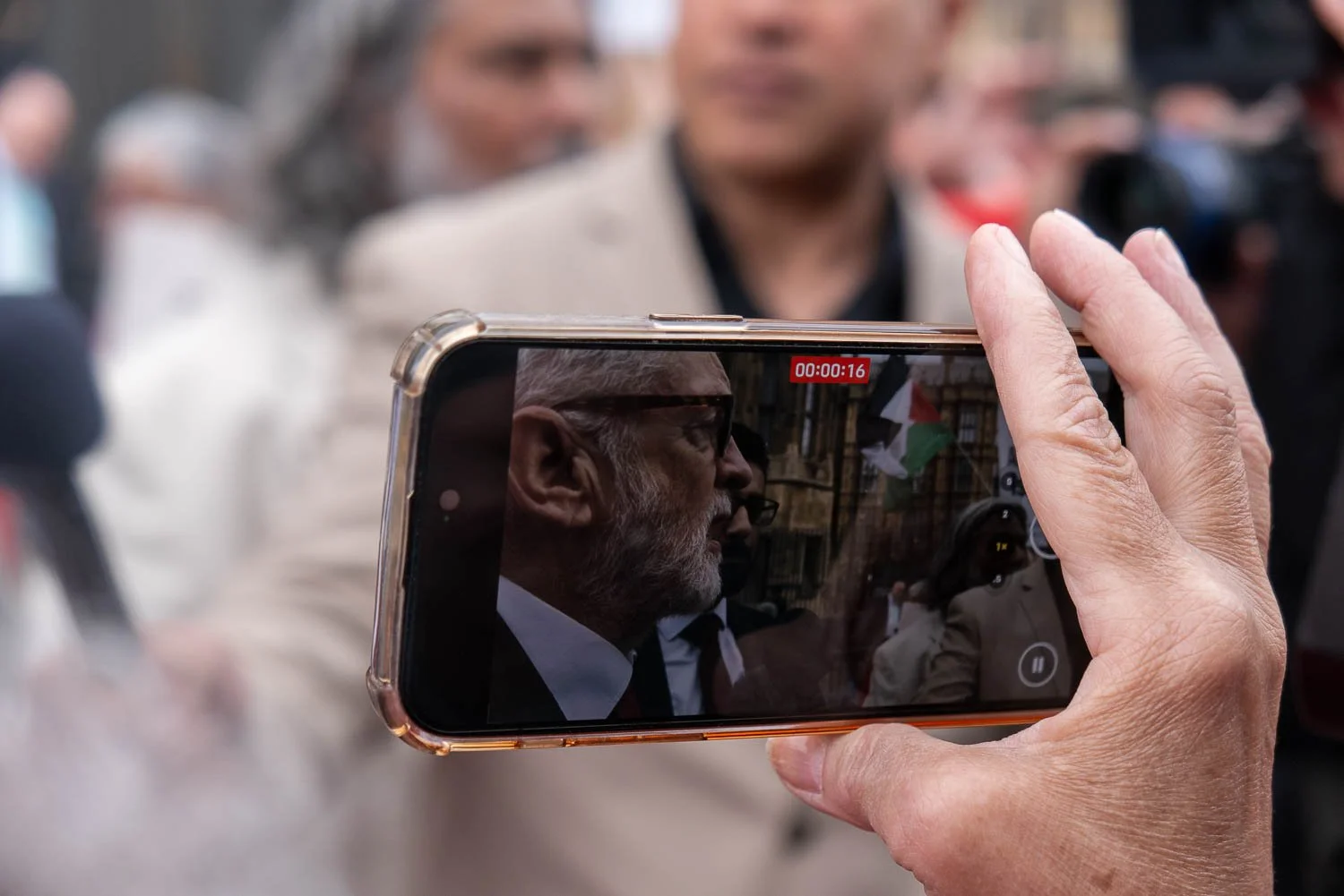 An image of a mobile phone videoing an interview with Jeremy Corbyn