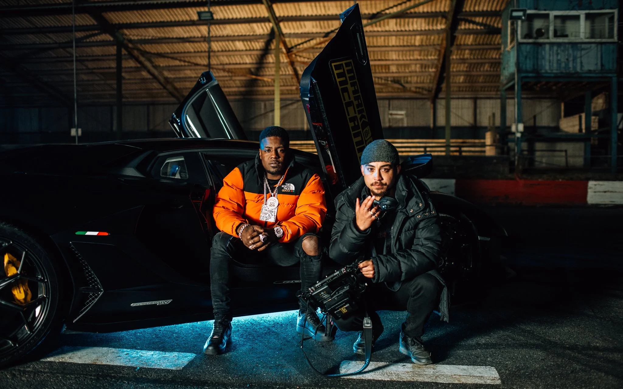 LG Vision poses with missed in a Lamborghini