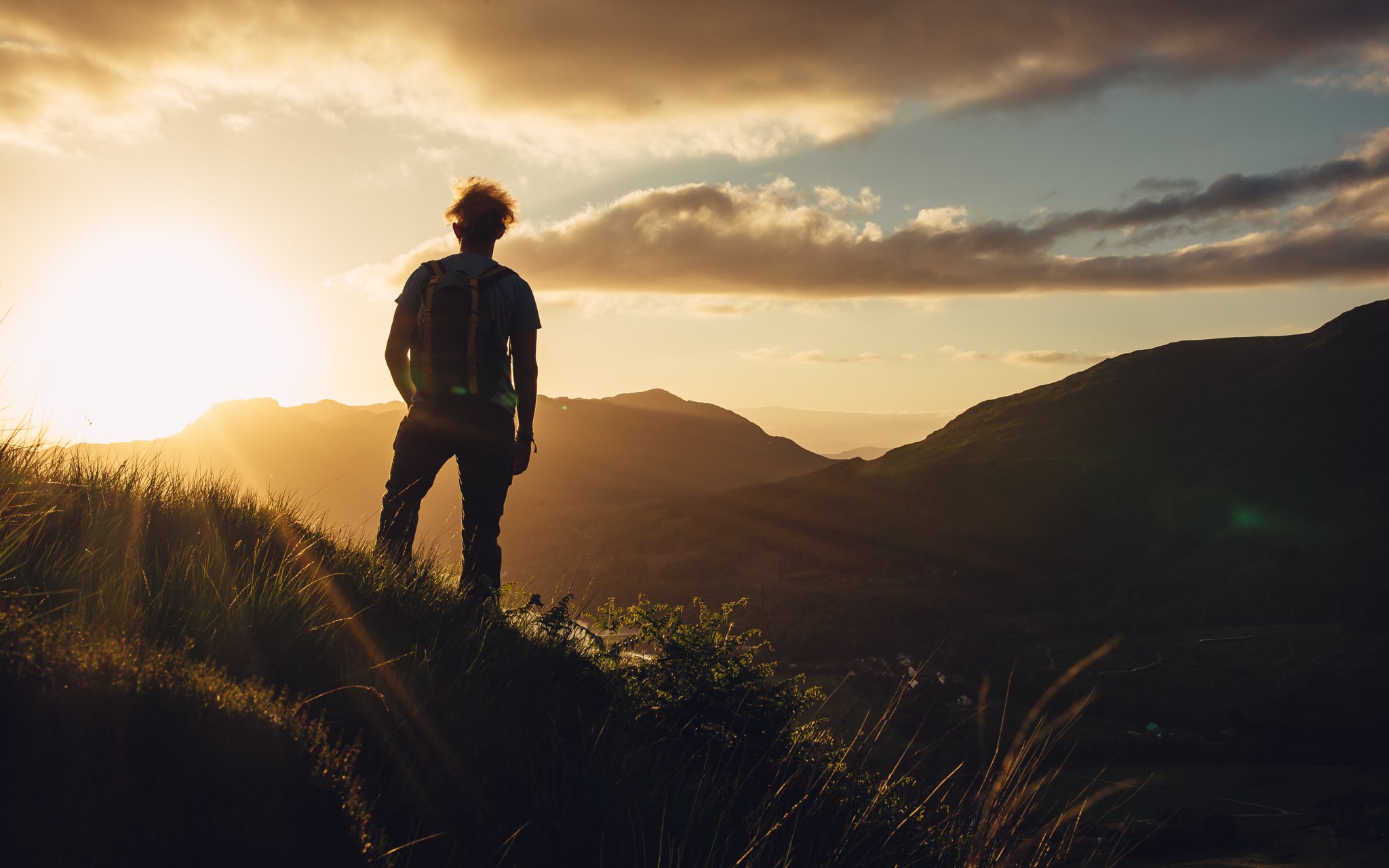  man, stands amongst the mountains, sunset, Scotland