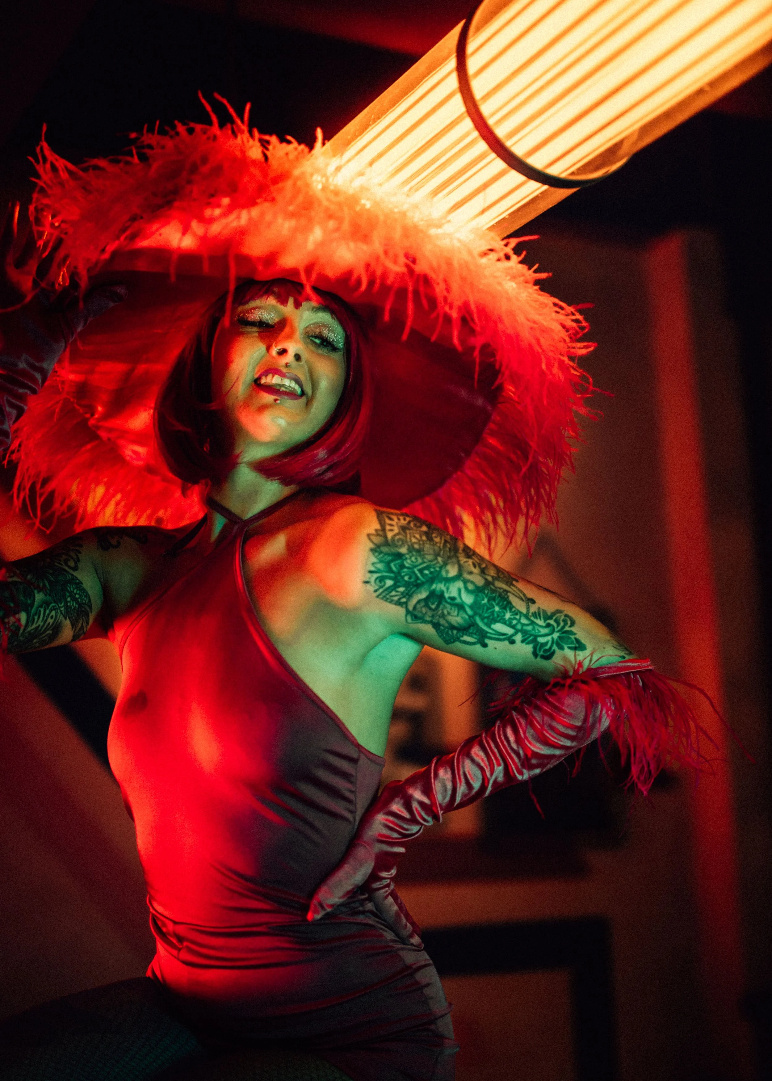  girl poses in red fluffy sombrero