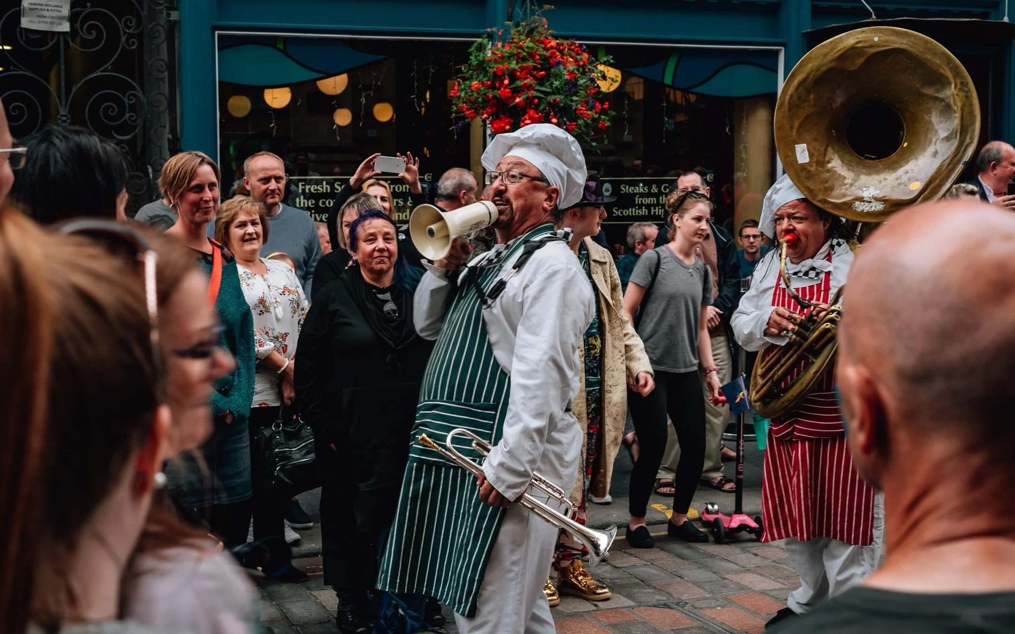 A street band performer with a megaphone in Glasgow city centre