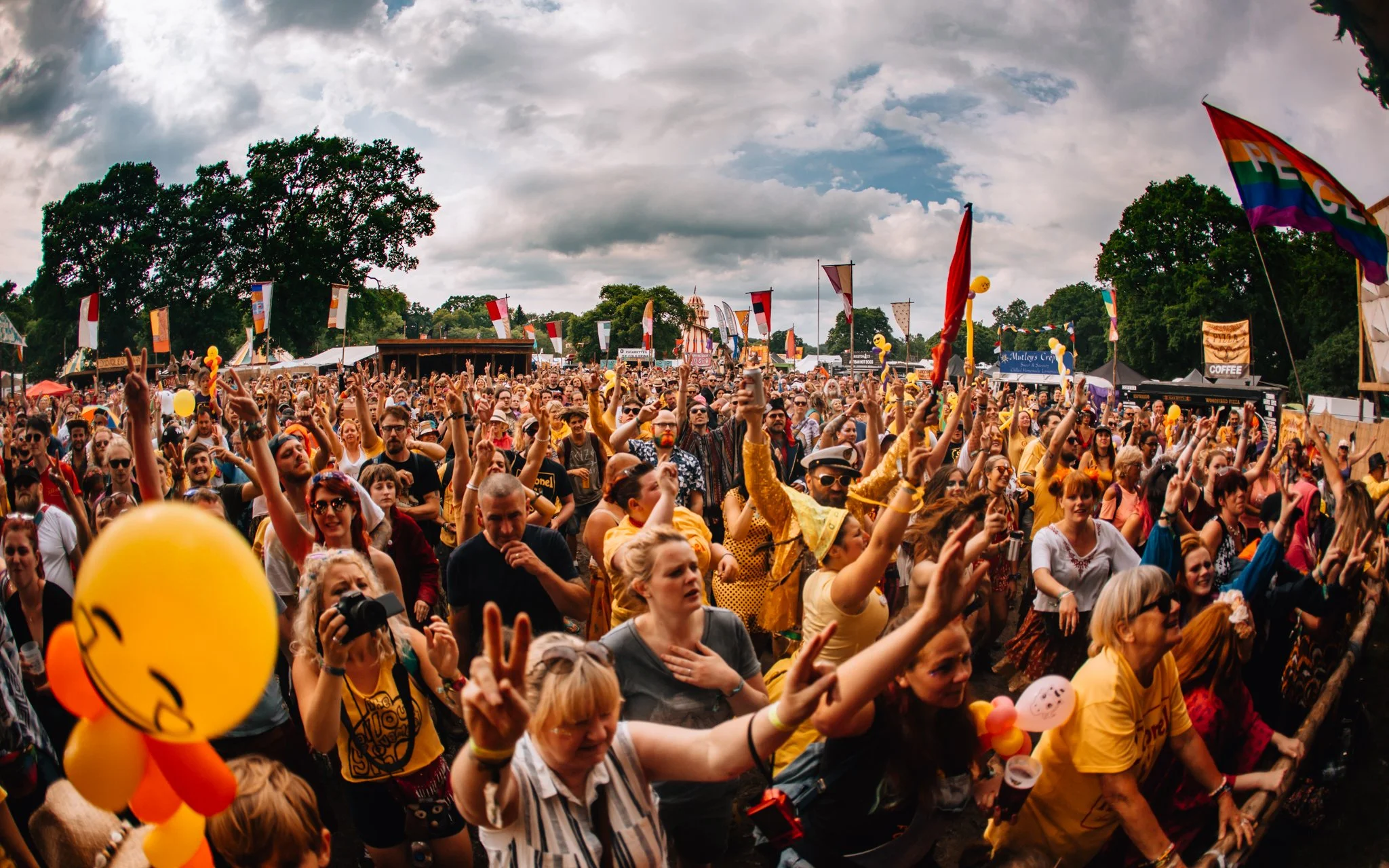 A crowd of people dancing at Aidan festival in Scotland