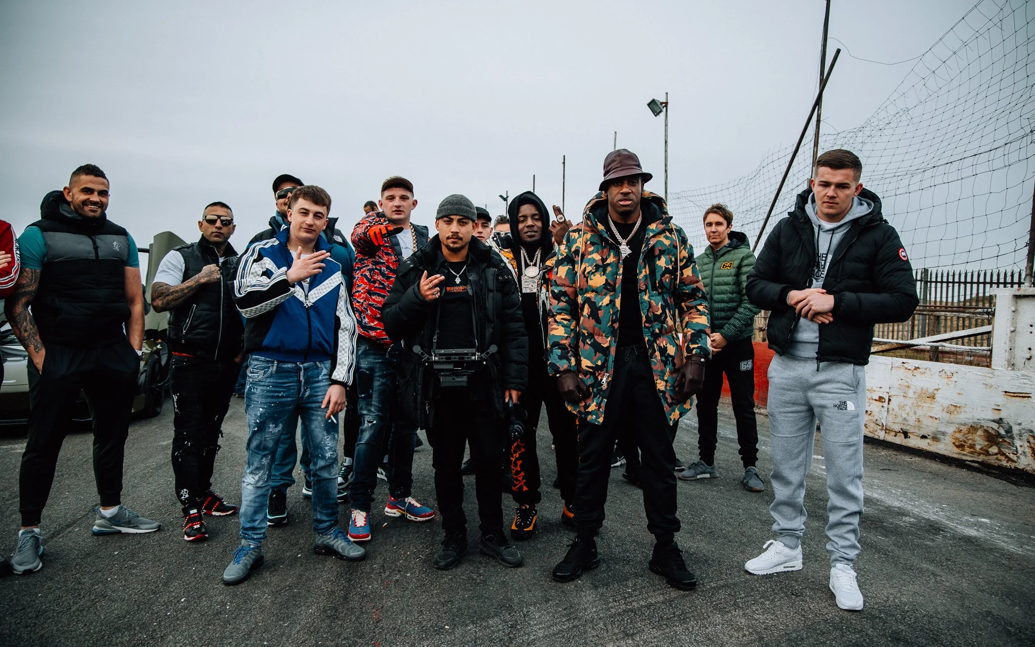 LG Vision poses with Bugzy Malone, the bad boy, Chiller, Crew, Mist and French the kid on the during the BMW music video shoot