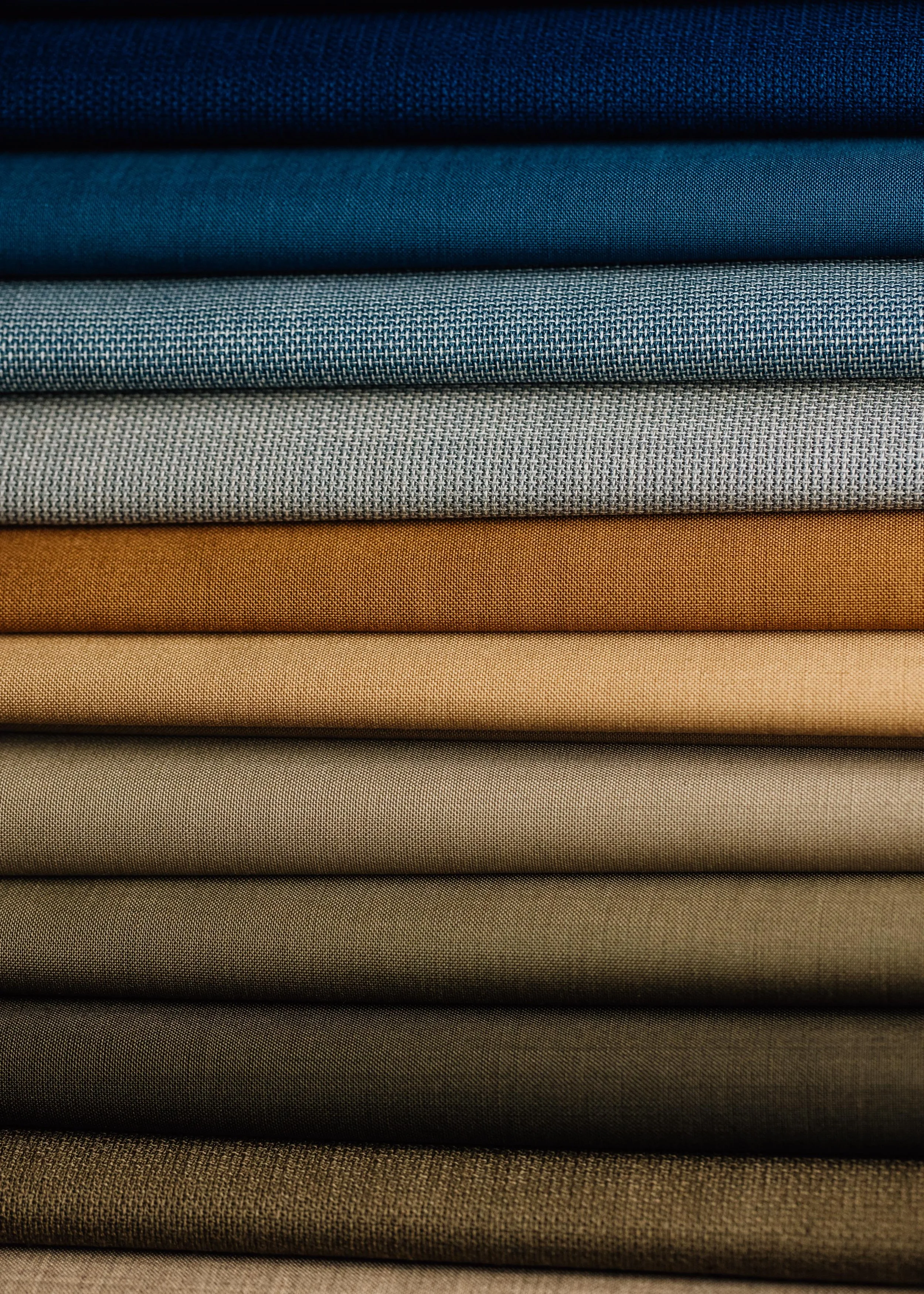 Selection of blue and beige fabric made at Stanley Mills Weavers