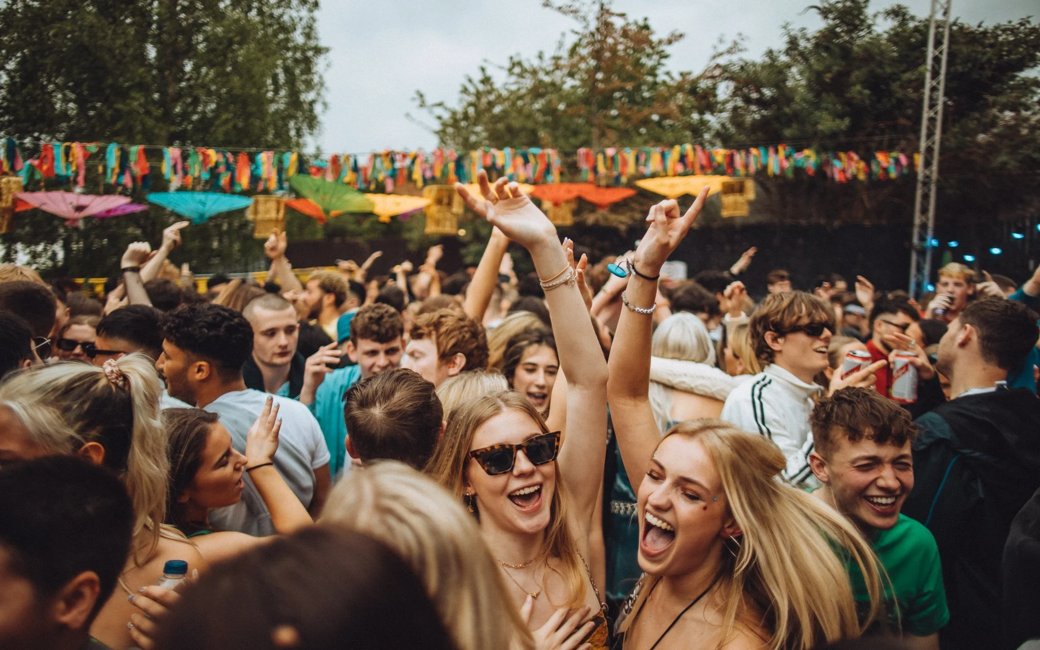  girls dancing at an inner-city music festival