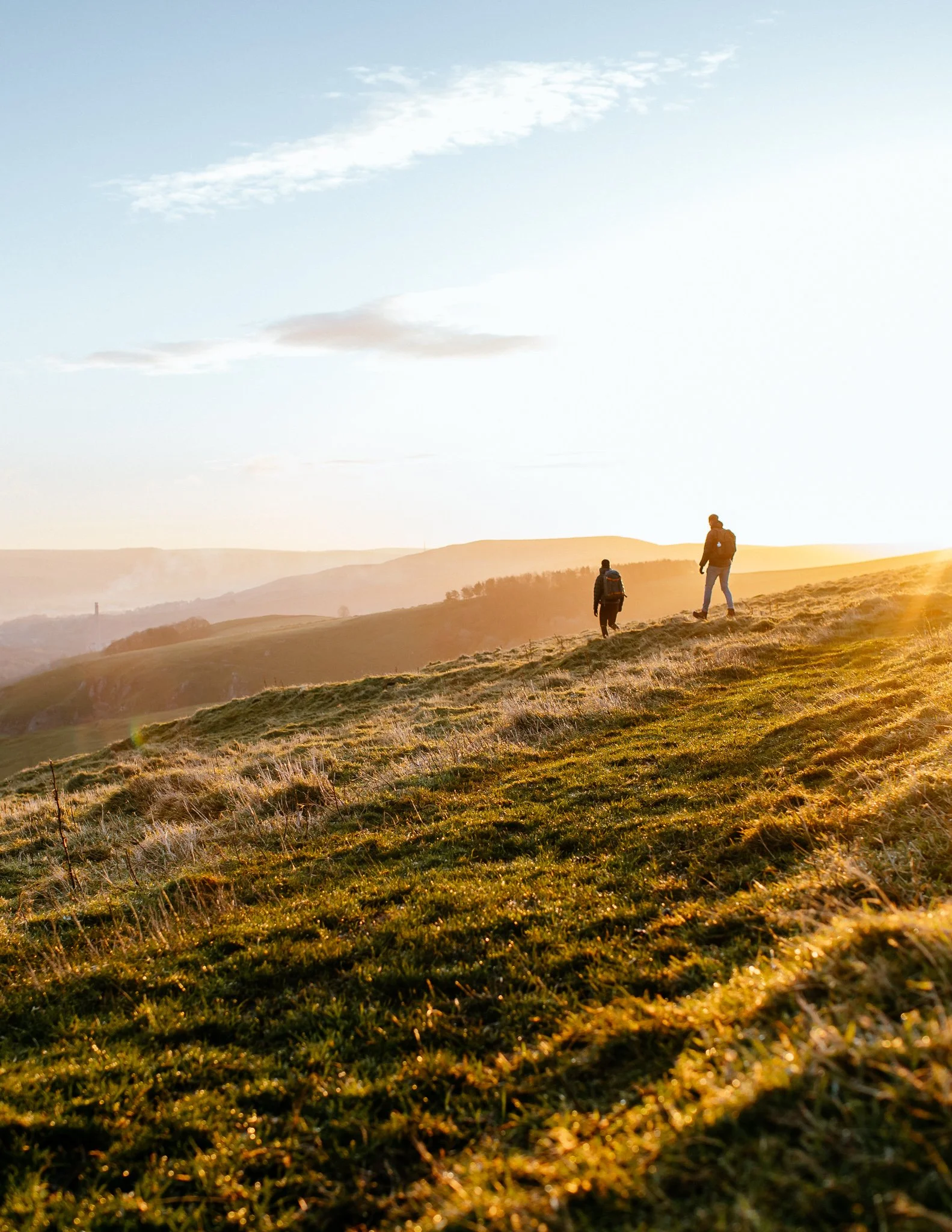  hikers in the sunrise, Peak District