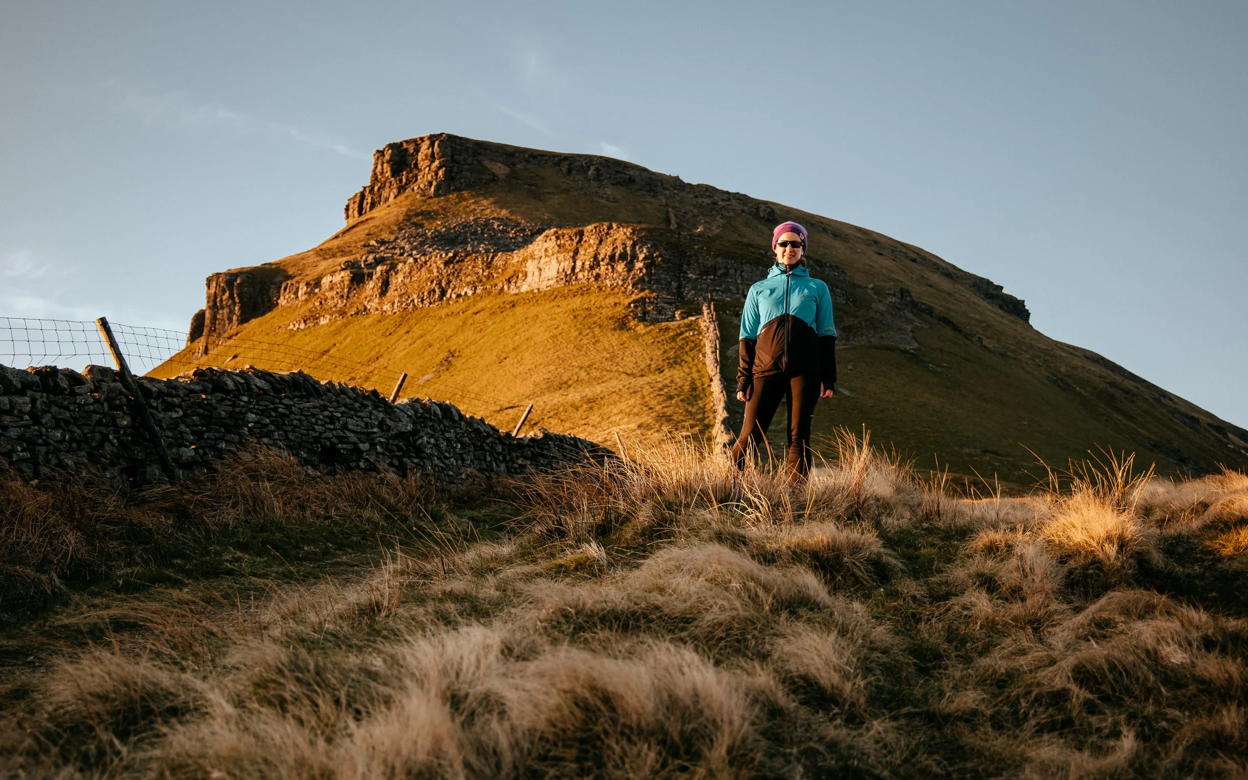  female fell runner stands in front of Pen y Ghent