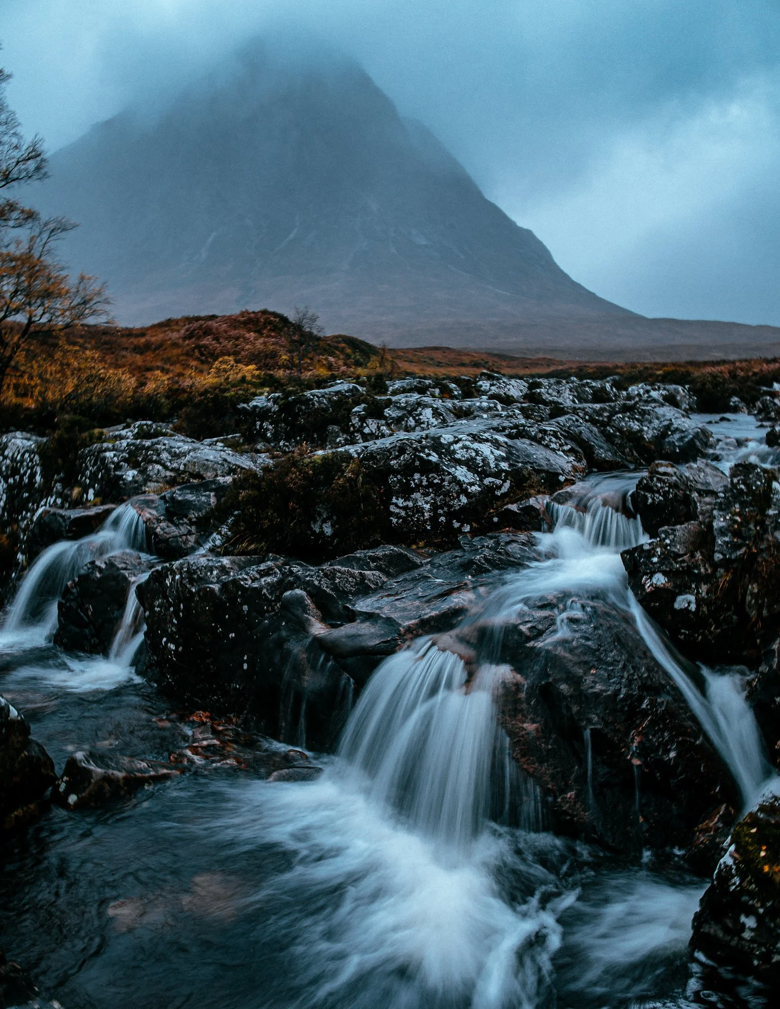  autumn waterfall in from of Buachaille Etive Mòr, scotland