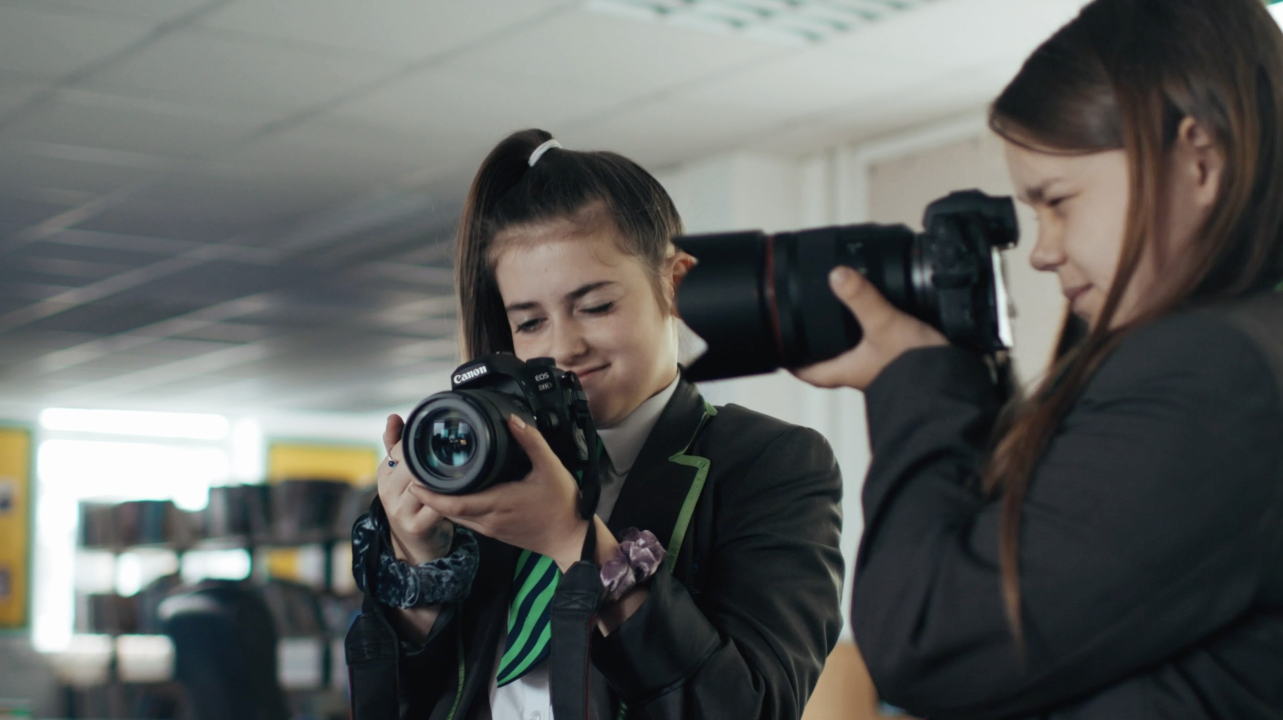 School children use cameras in Cannon young peoples