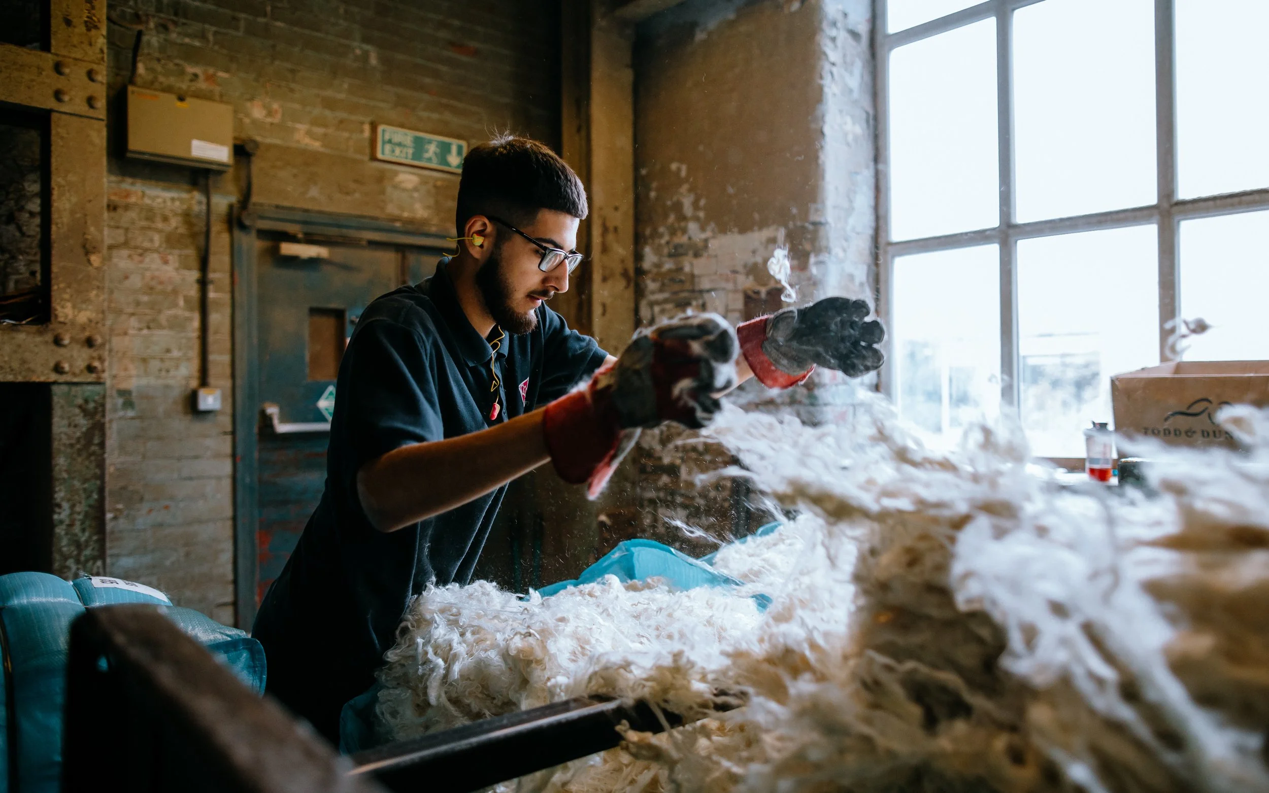 Man, Leeds, Kashmir fibres into machine
