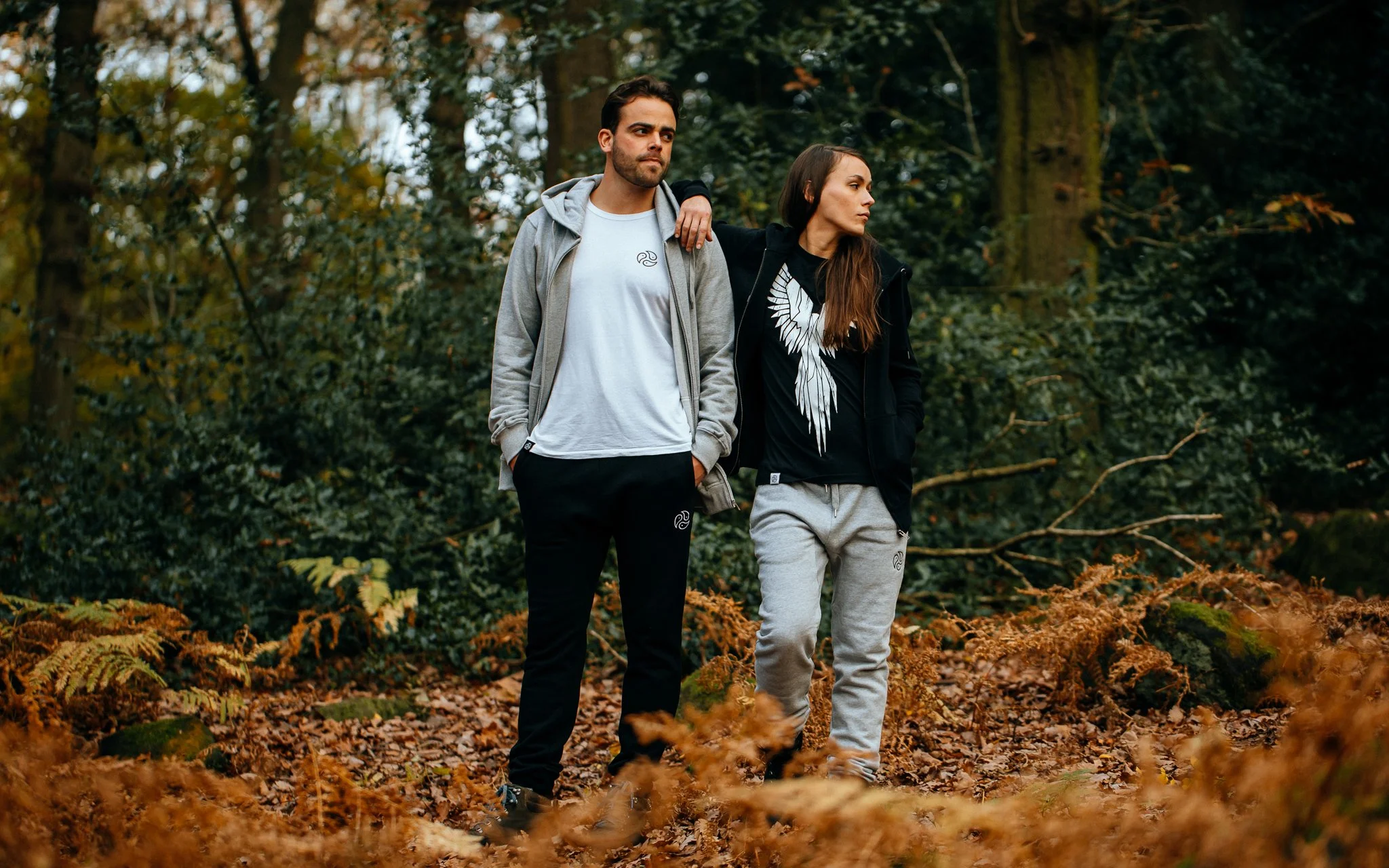 Male and female model pose in Woods wearing tomoto clothes