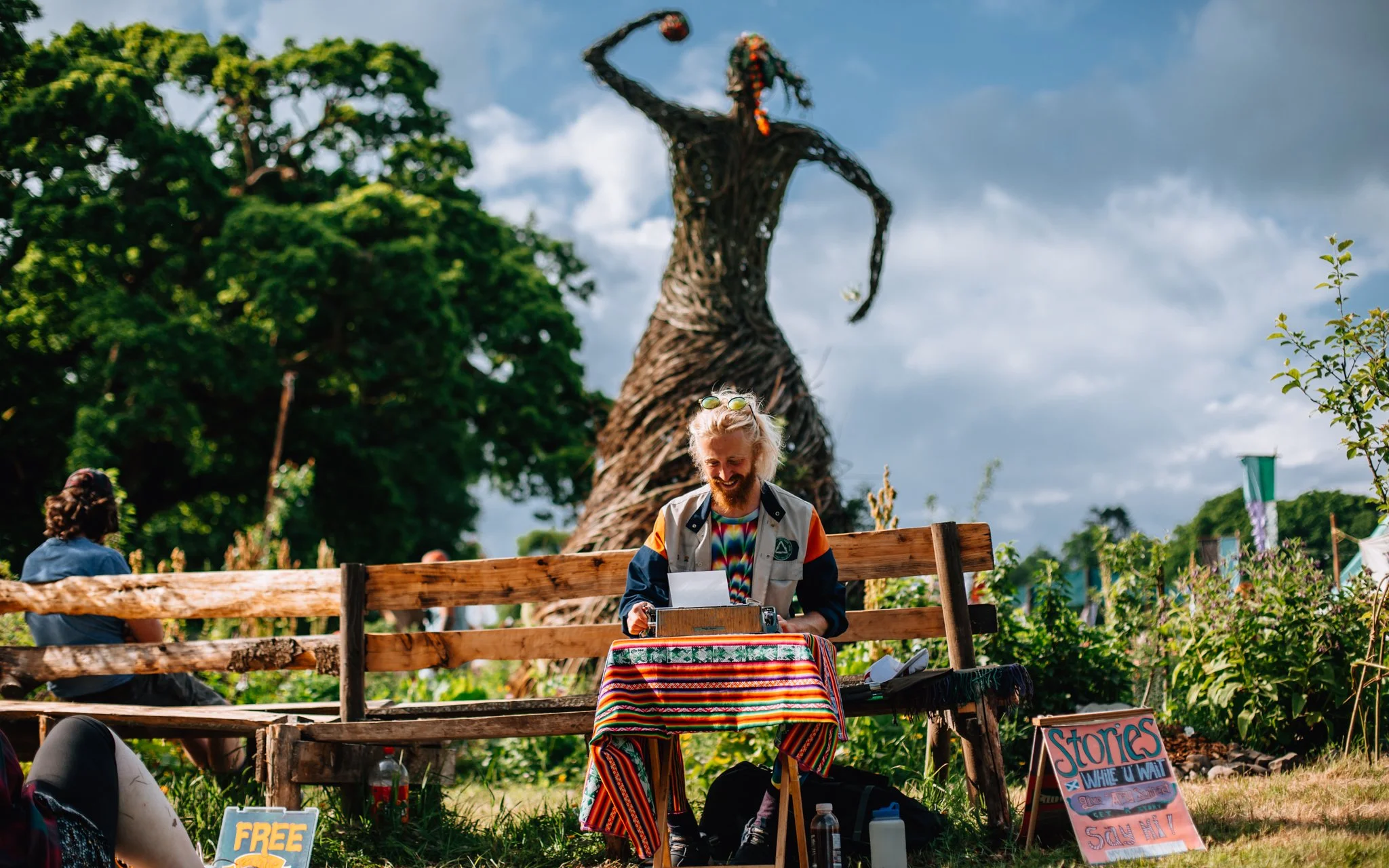  a poet and writer sit in the garden of Eden at Eden festival Scotland