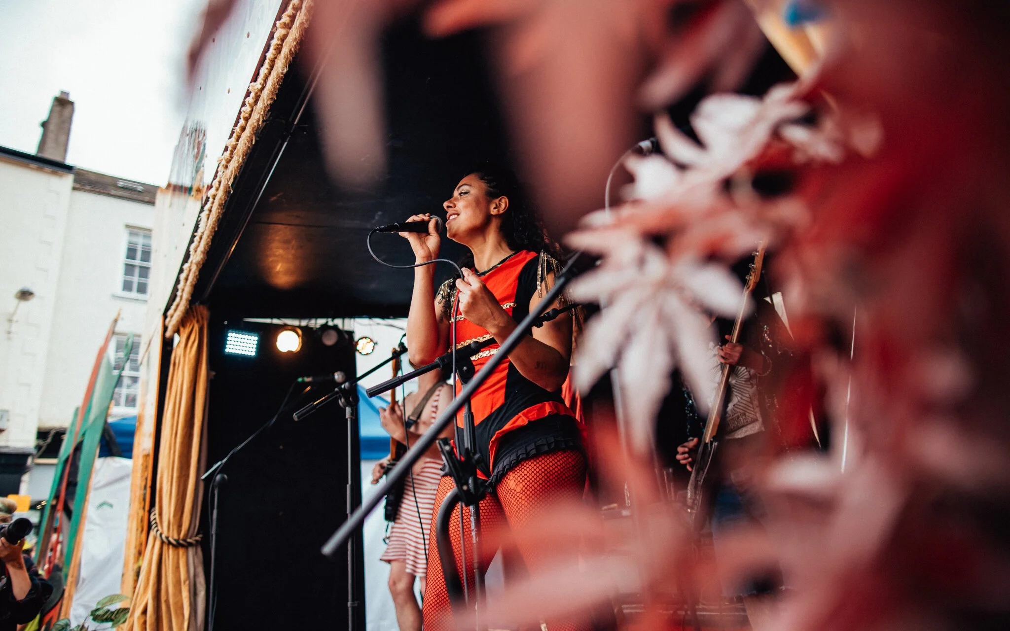 a singer singing on the stage at a music festival in ulverston Lake District