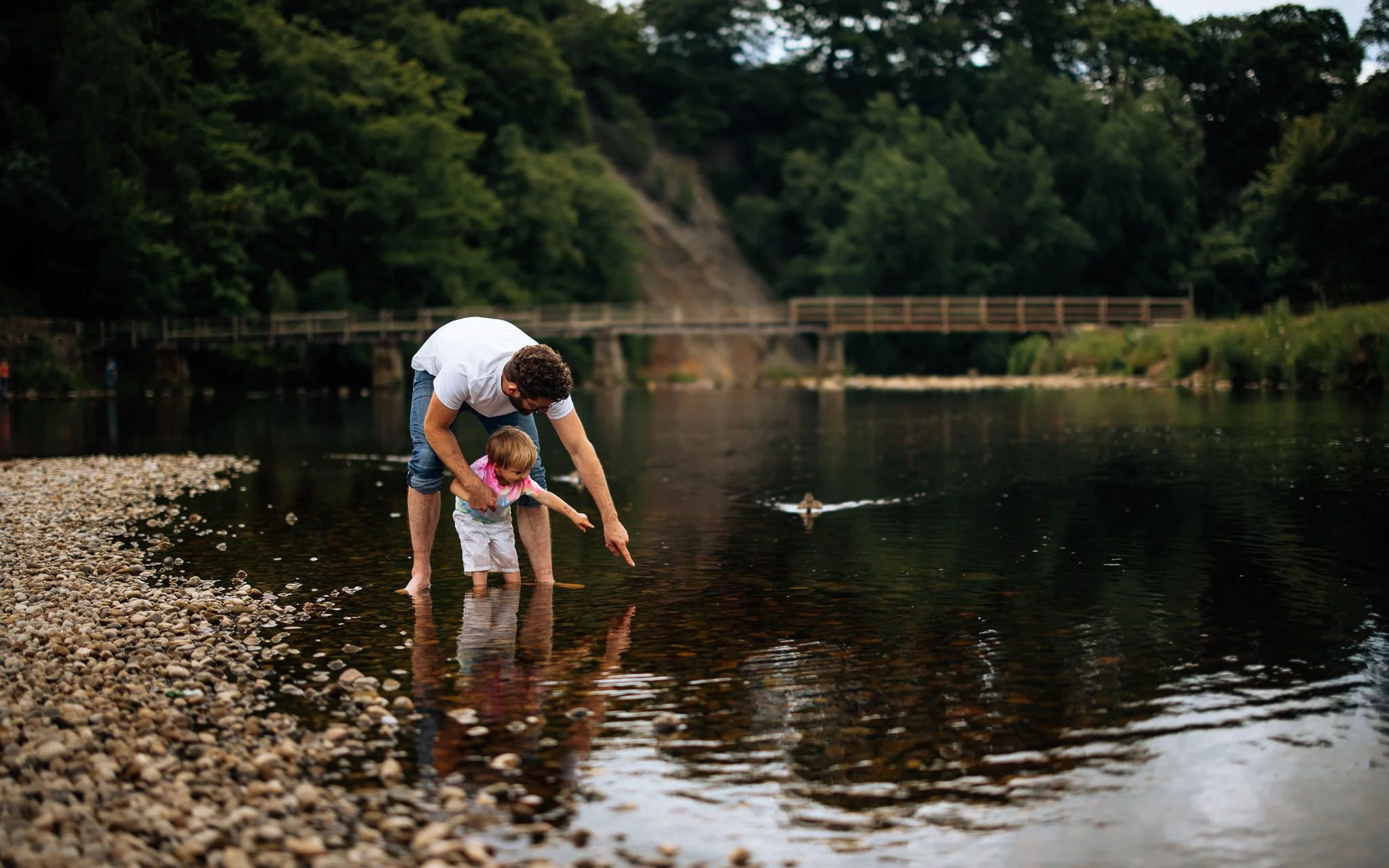  father and child paddle in the river wharfe