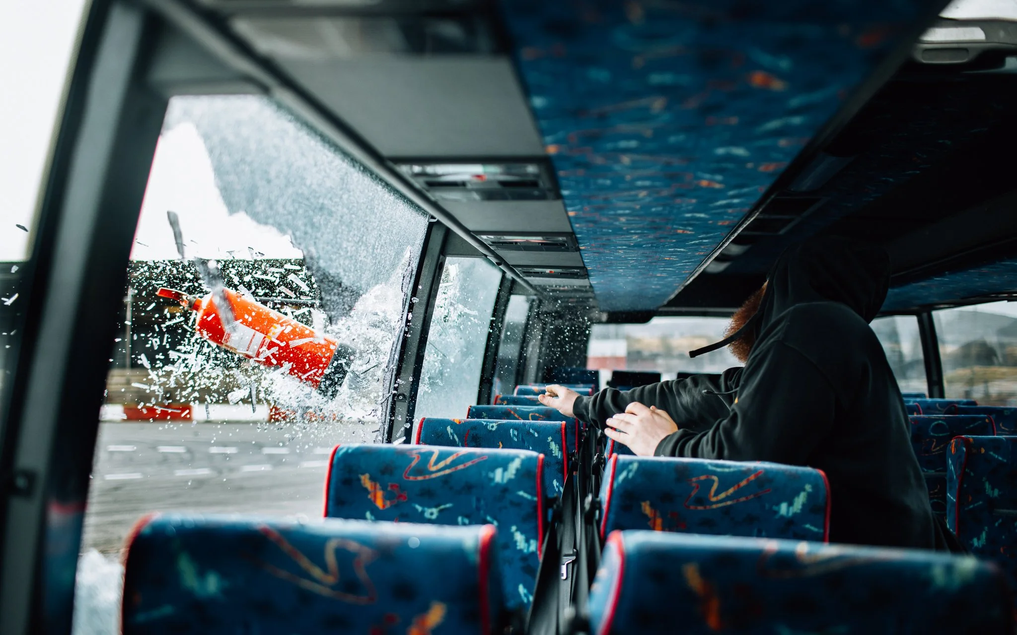  man throws fire extinguisher through window of bus