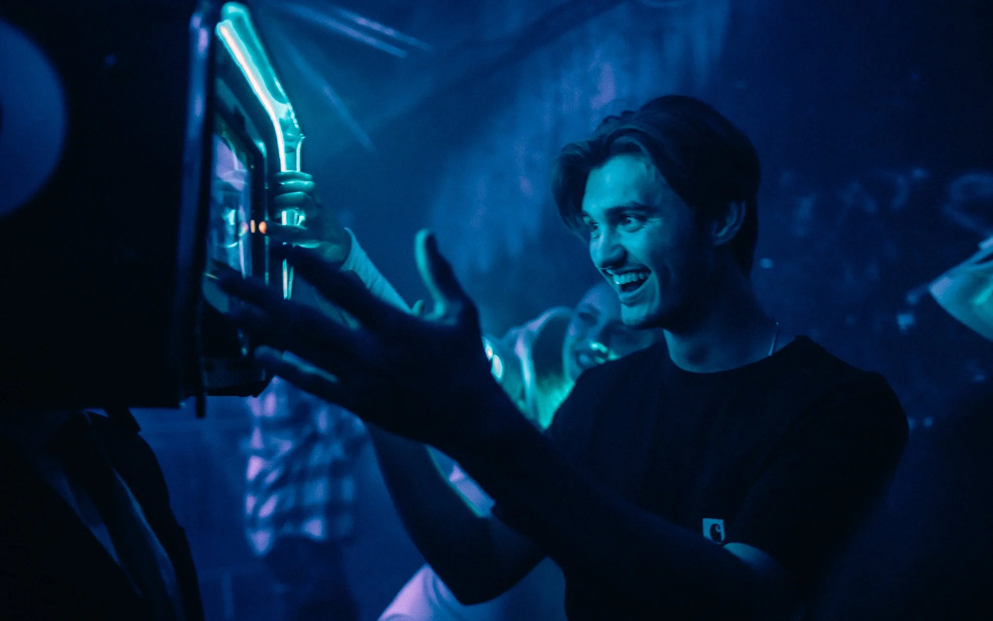  man, interacts, with performer in nightclub