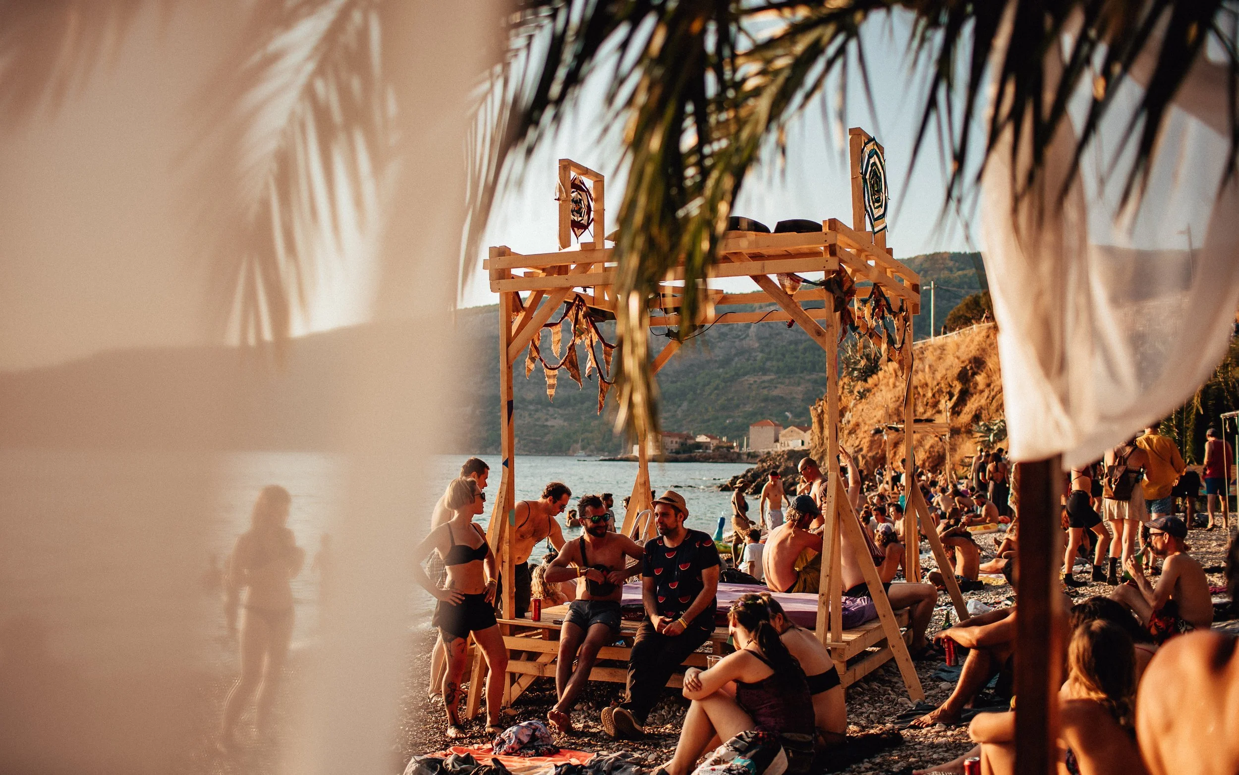  people relax on the beach at a music festival in Croatia