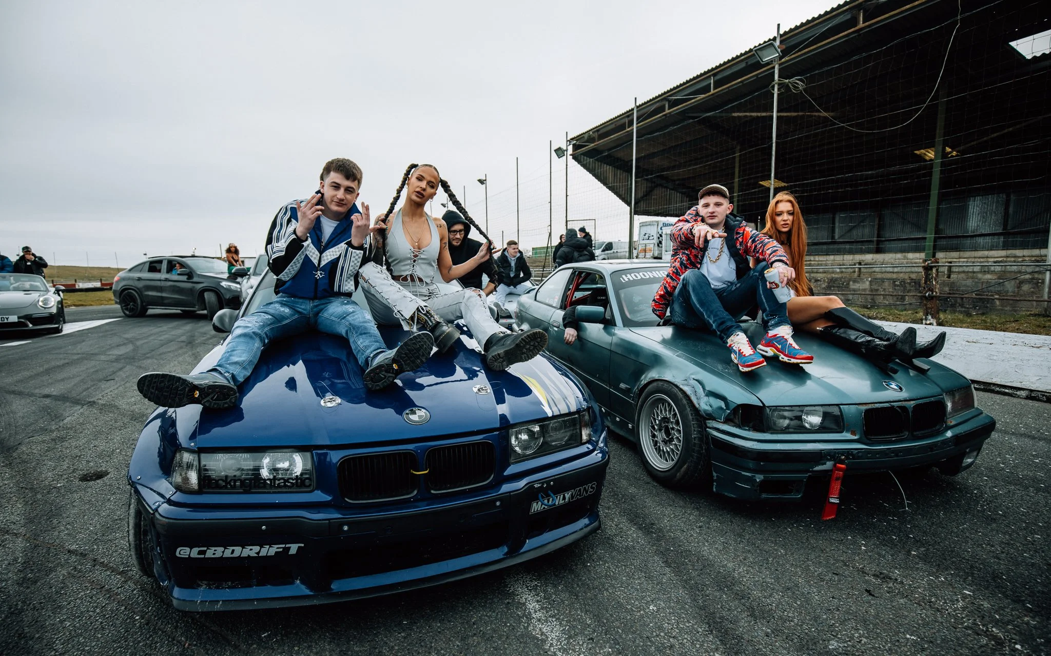  bad boy Chiller Crew pose on BMWs with models