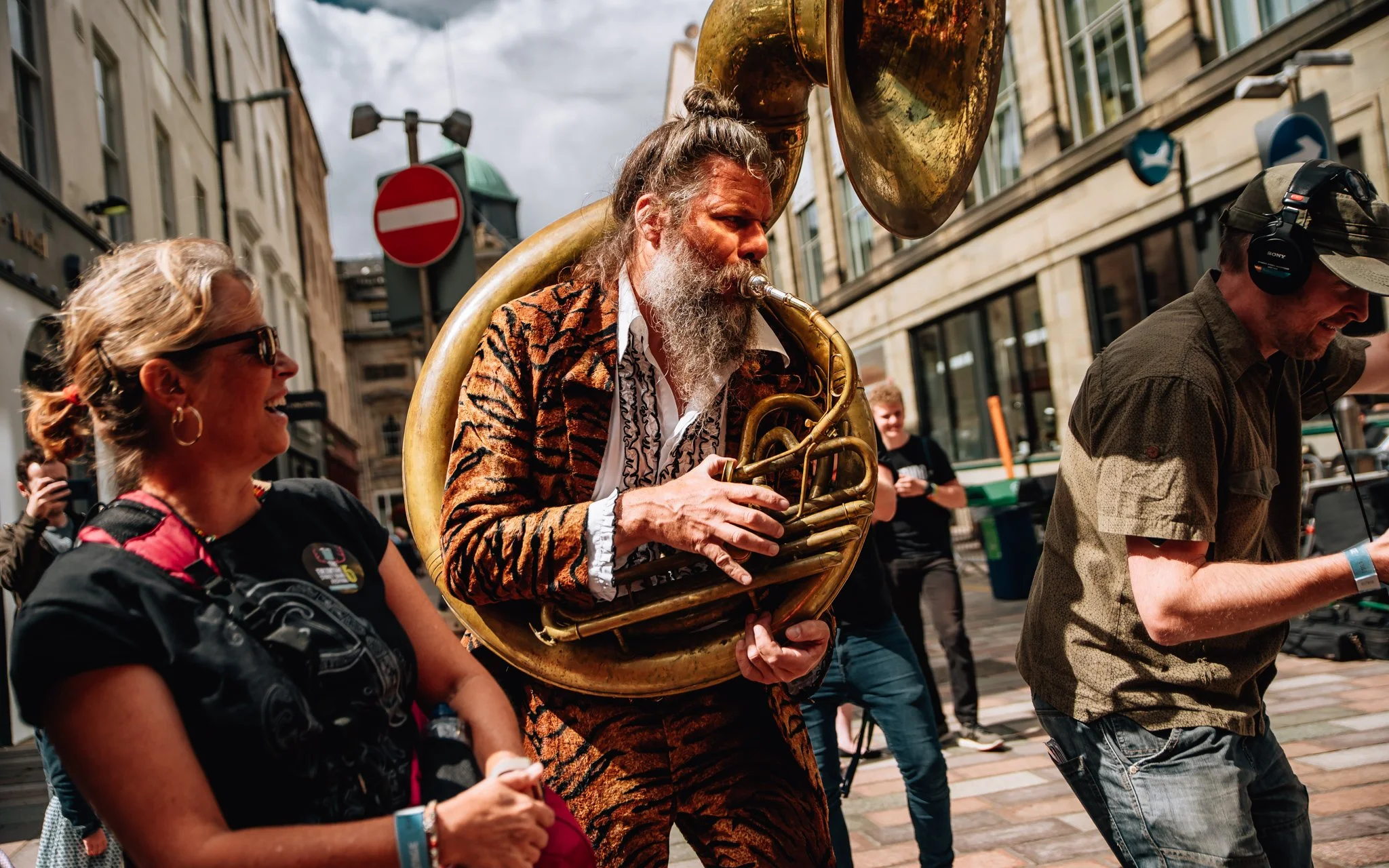  a man with a sousaphone performs in Glasgow