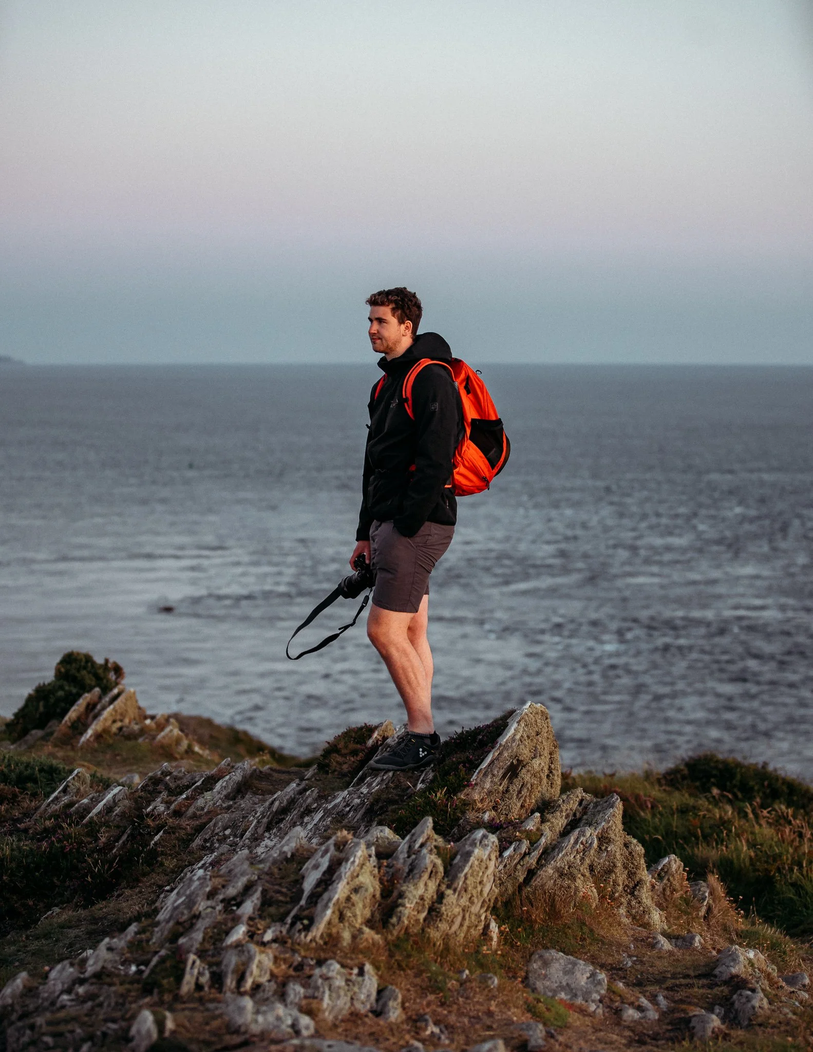  Portraits of man, standing on Cliff
