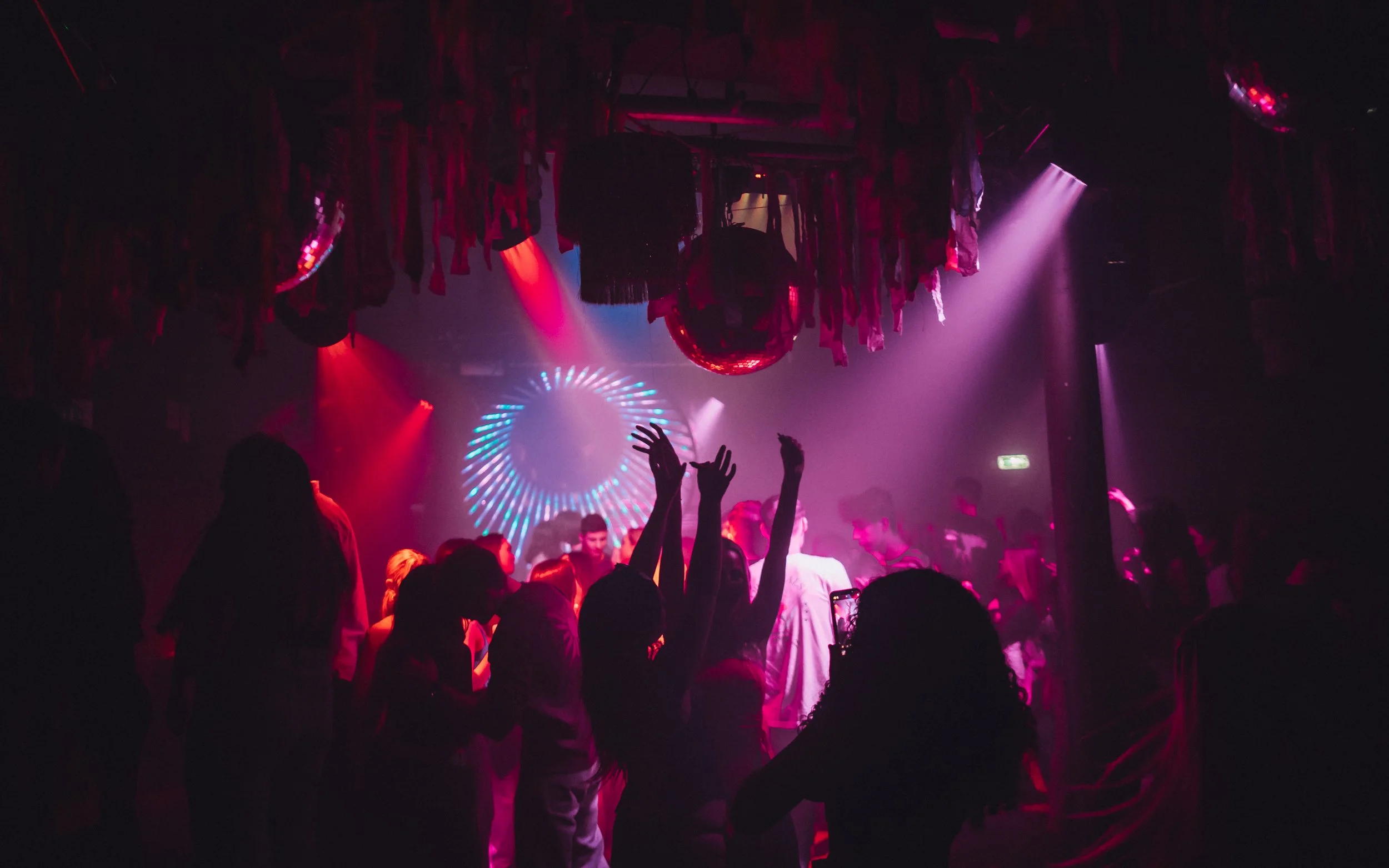 Hands in the air in nightclub