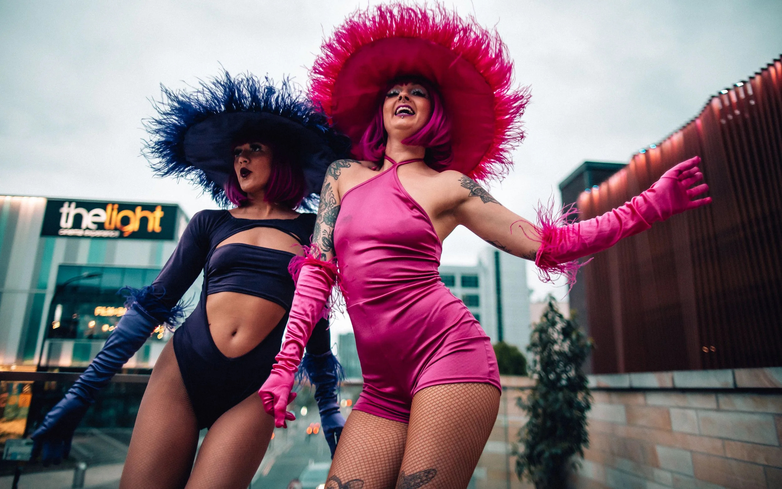  girls in fluffy sombreros dance on the table
