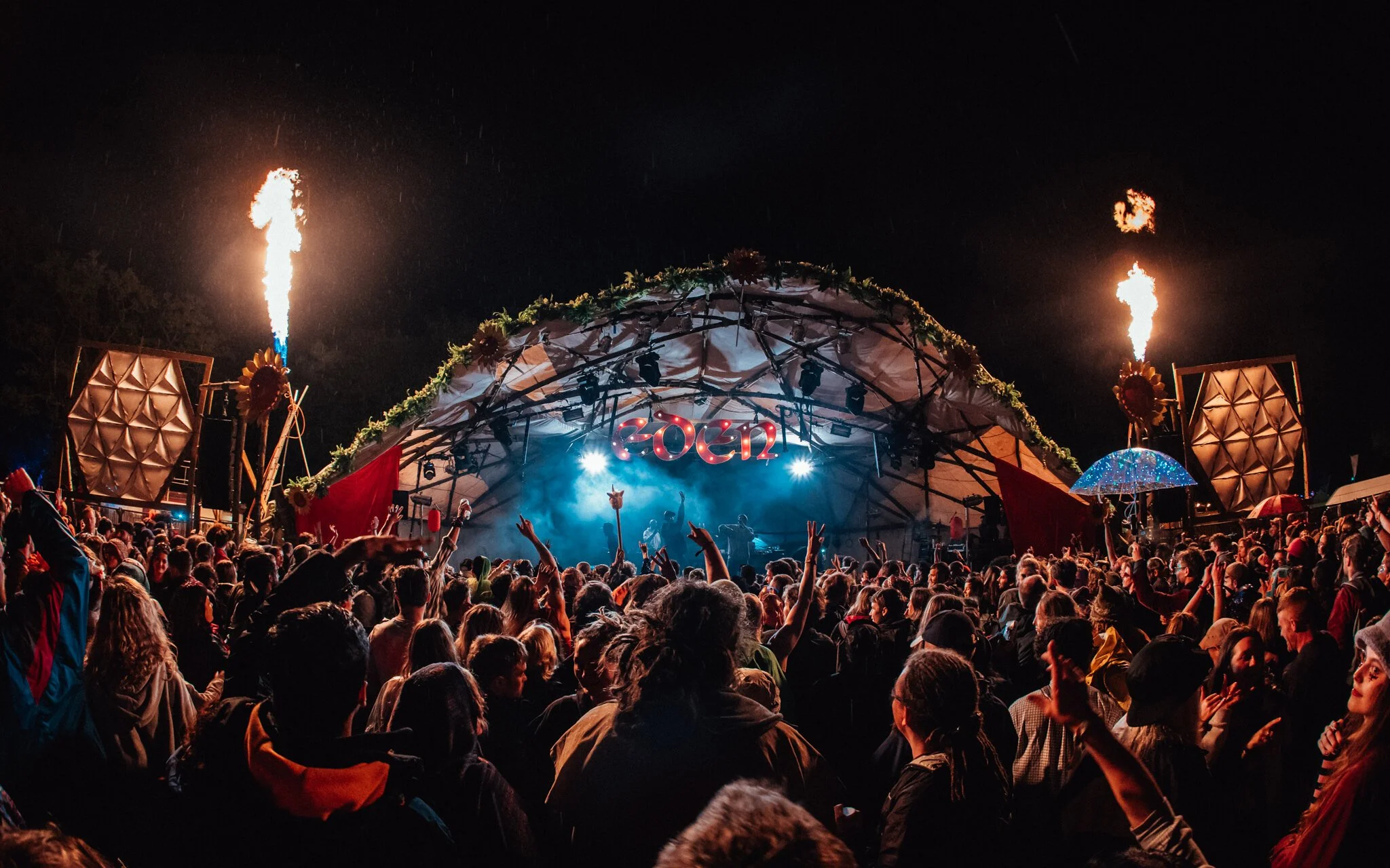  fire shoots into the air above the crowd at a music festival
