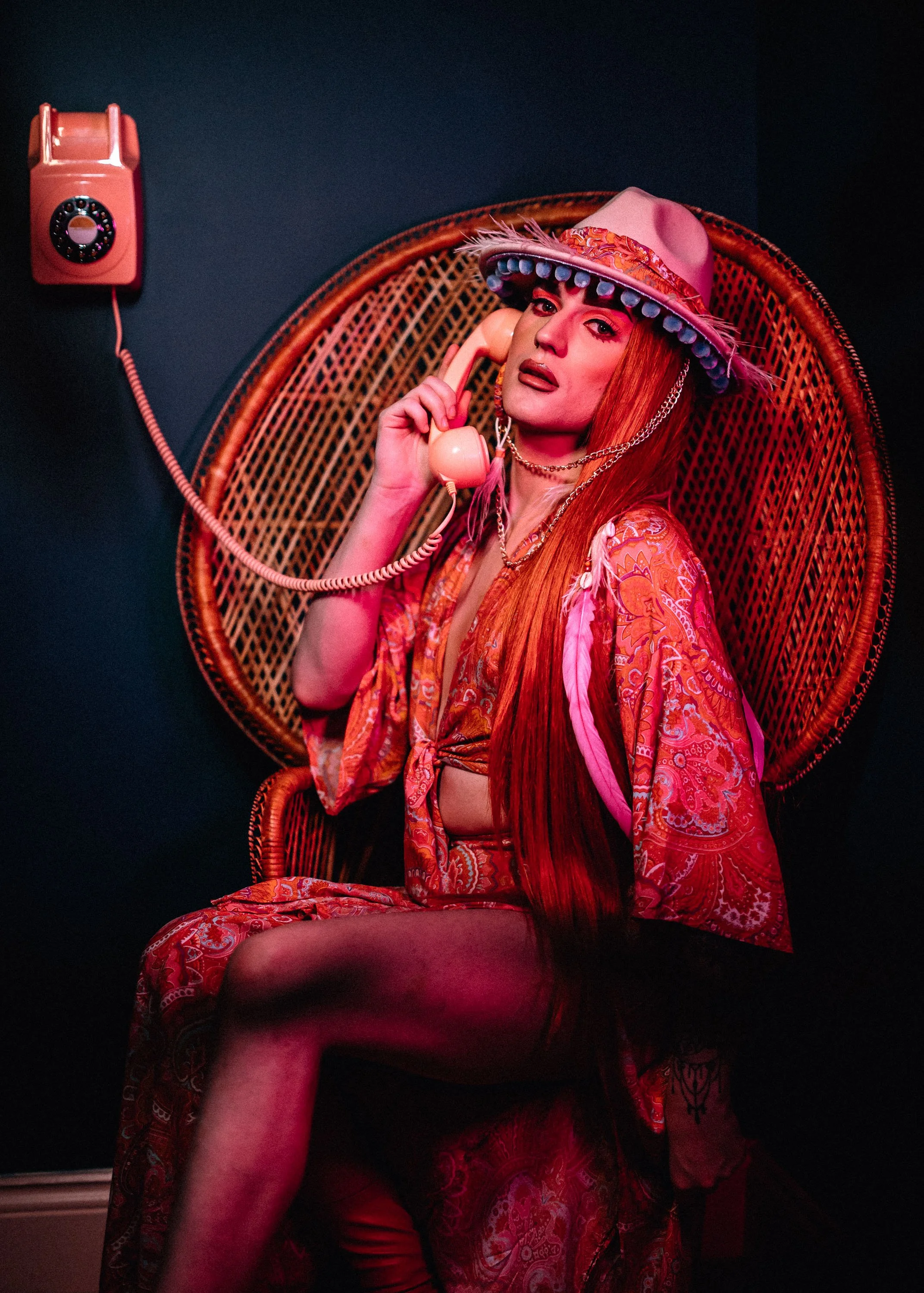 Girl uses telephone sitting in chair