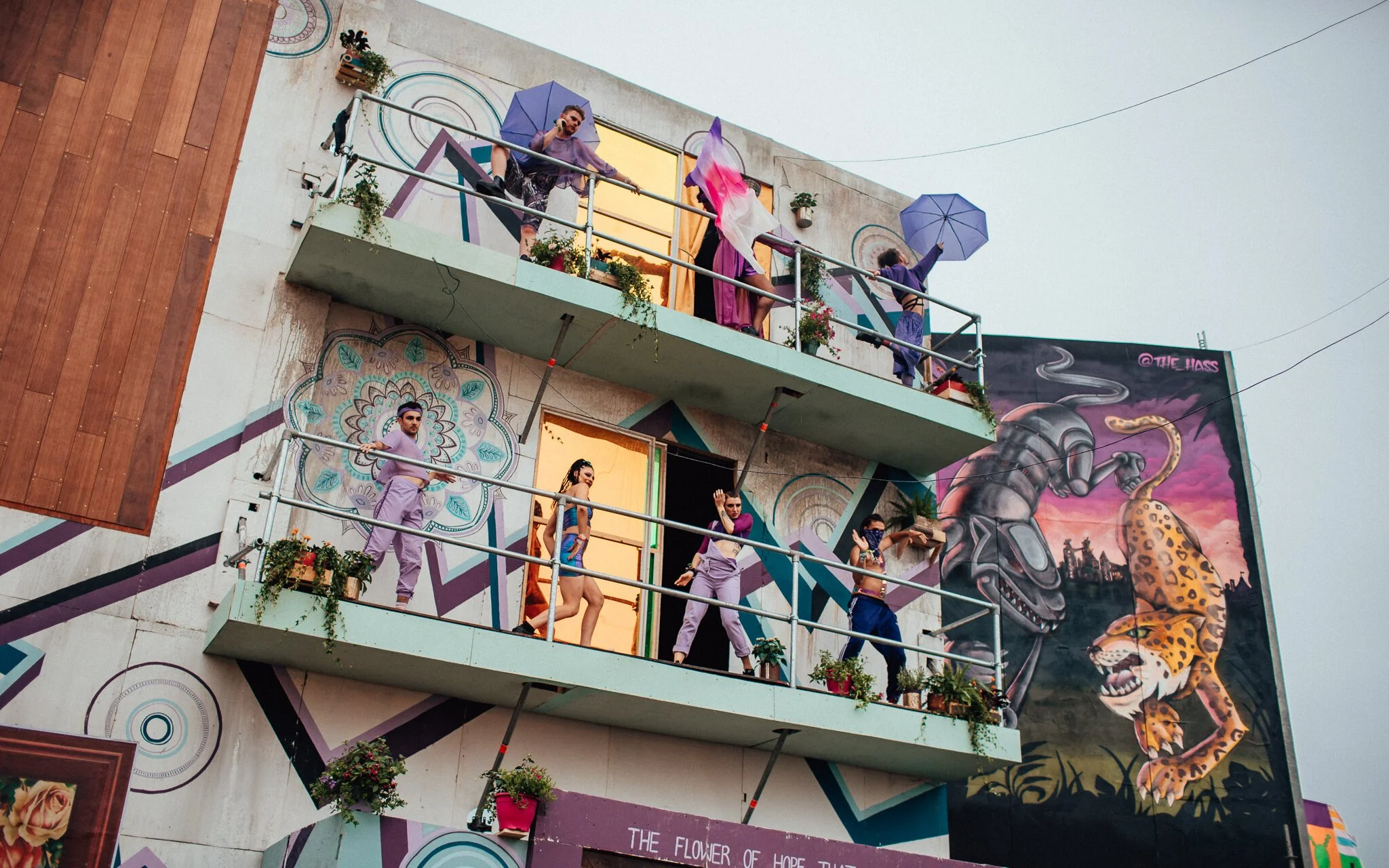  dancers dance on the balcony at boomtown fair music festival