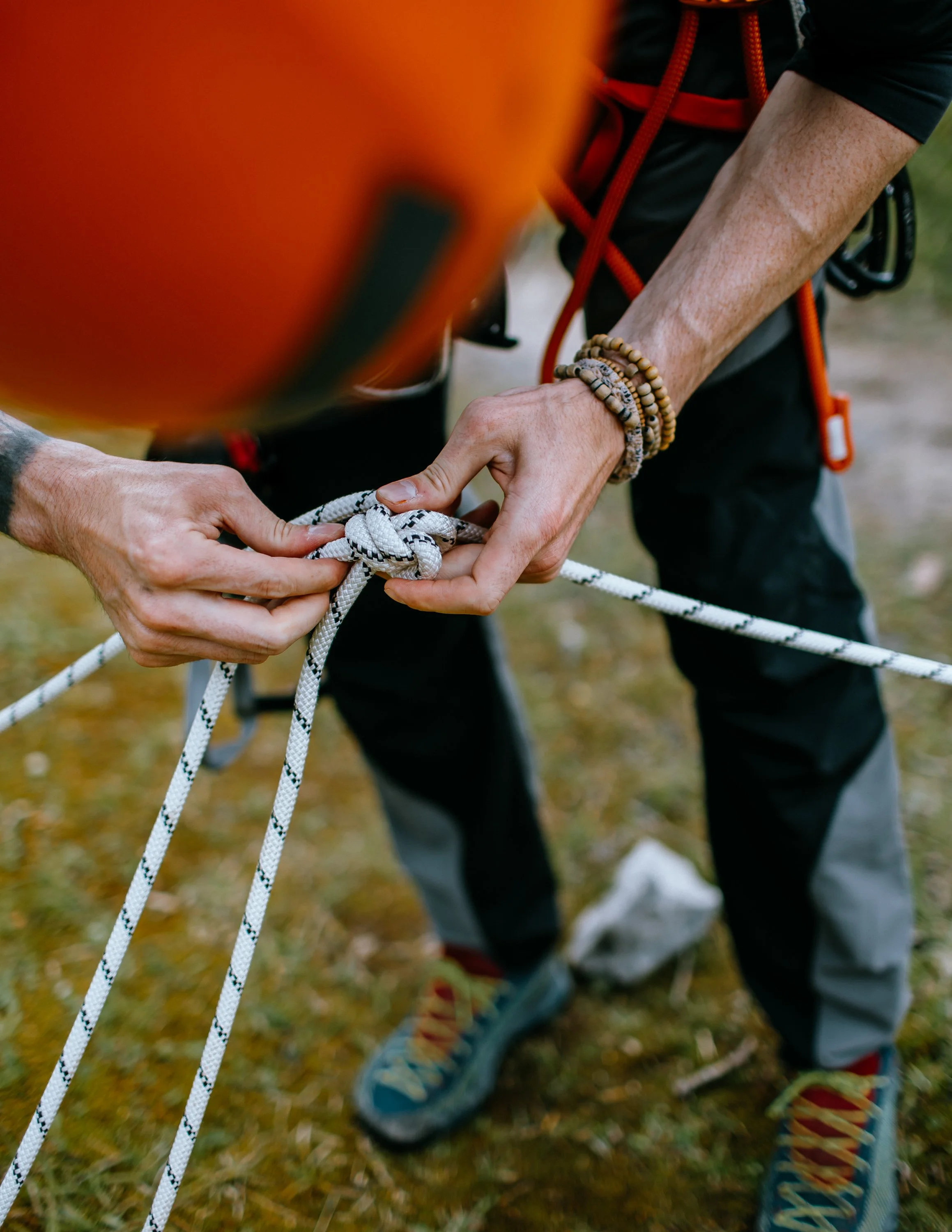 Climber ties, knots rigging in Peak District