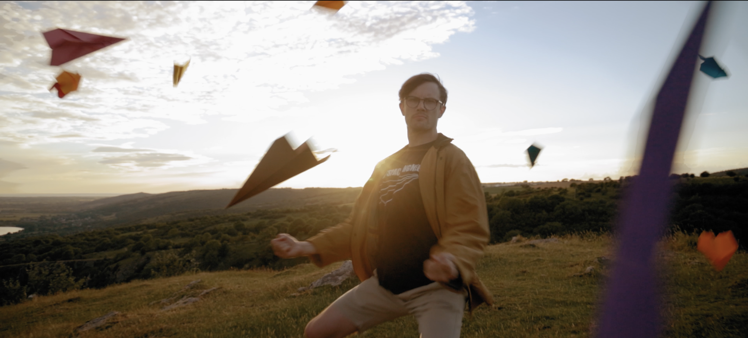Twogood Music video Garry fingerloaf dances among paper aeroplanes