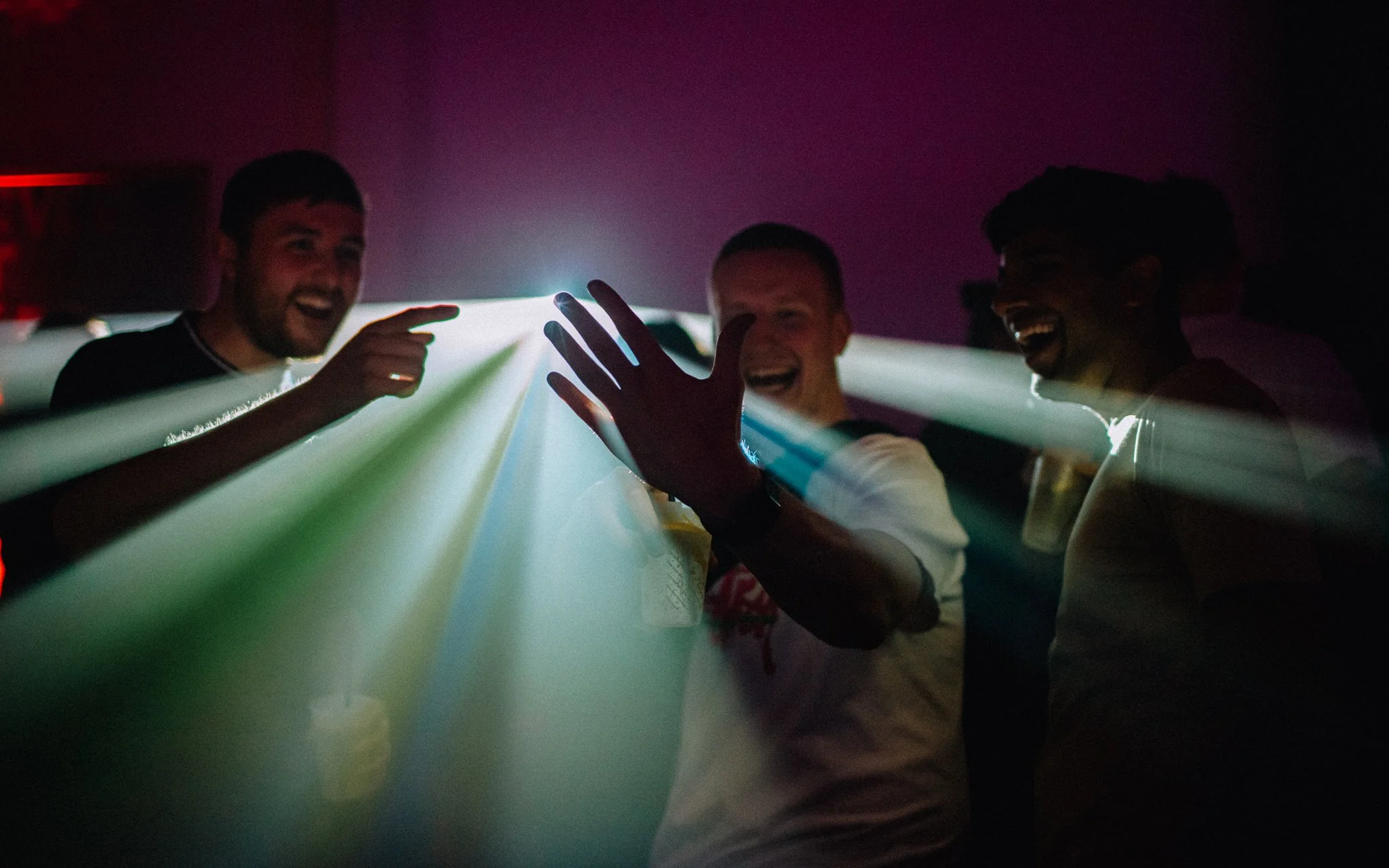  people look at projection on hands
