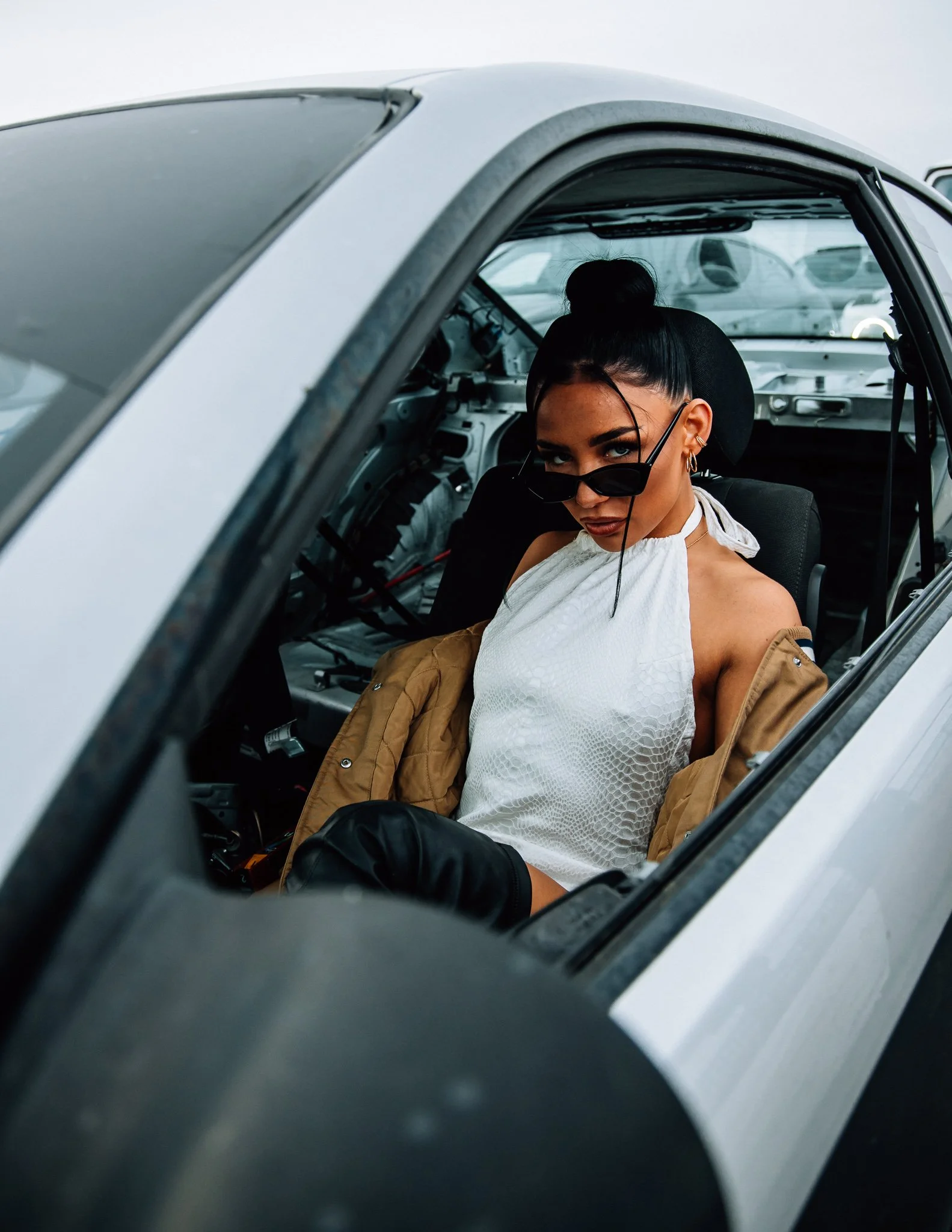 female model sit in the car