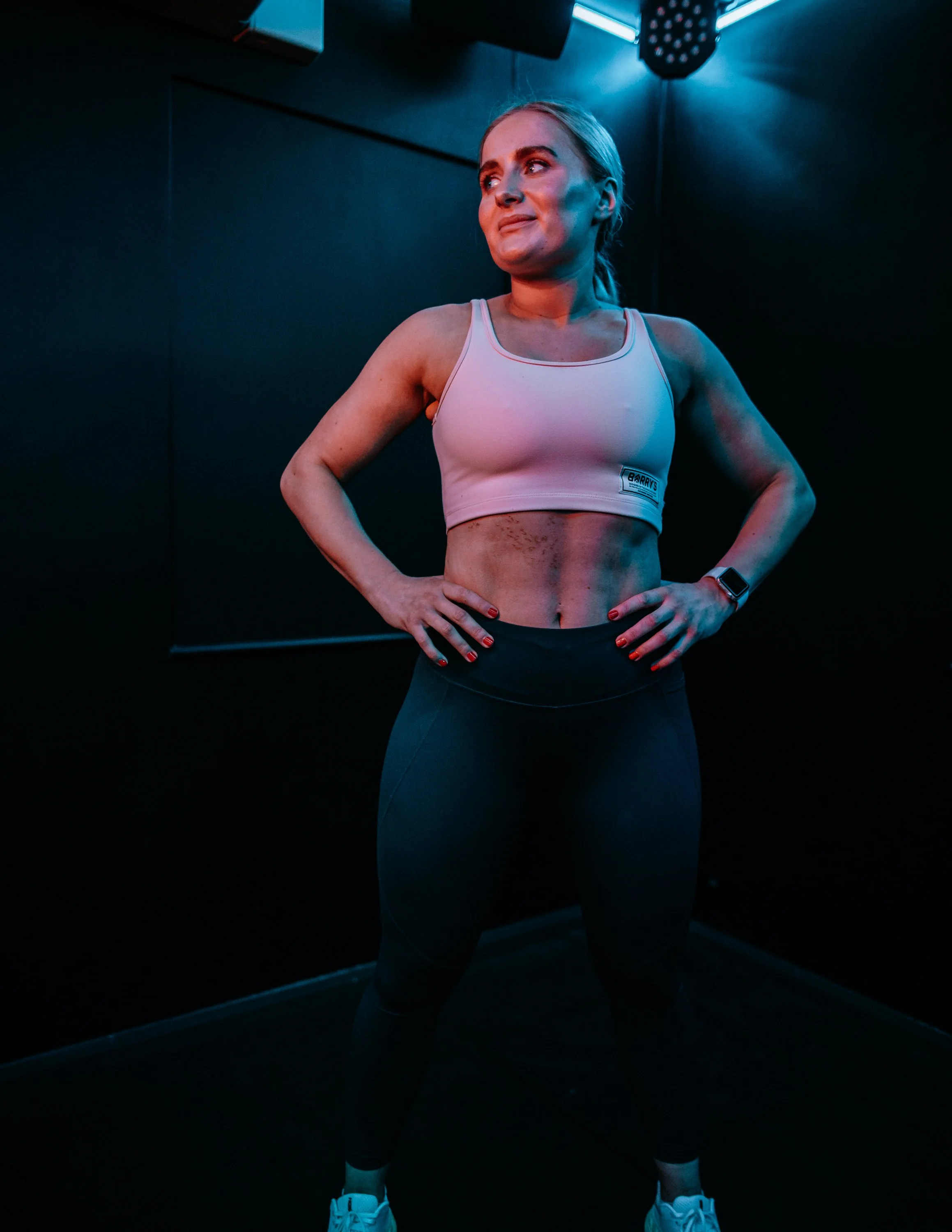  woman poses after work out at all, Studio Leeds