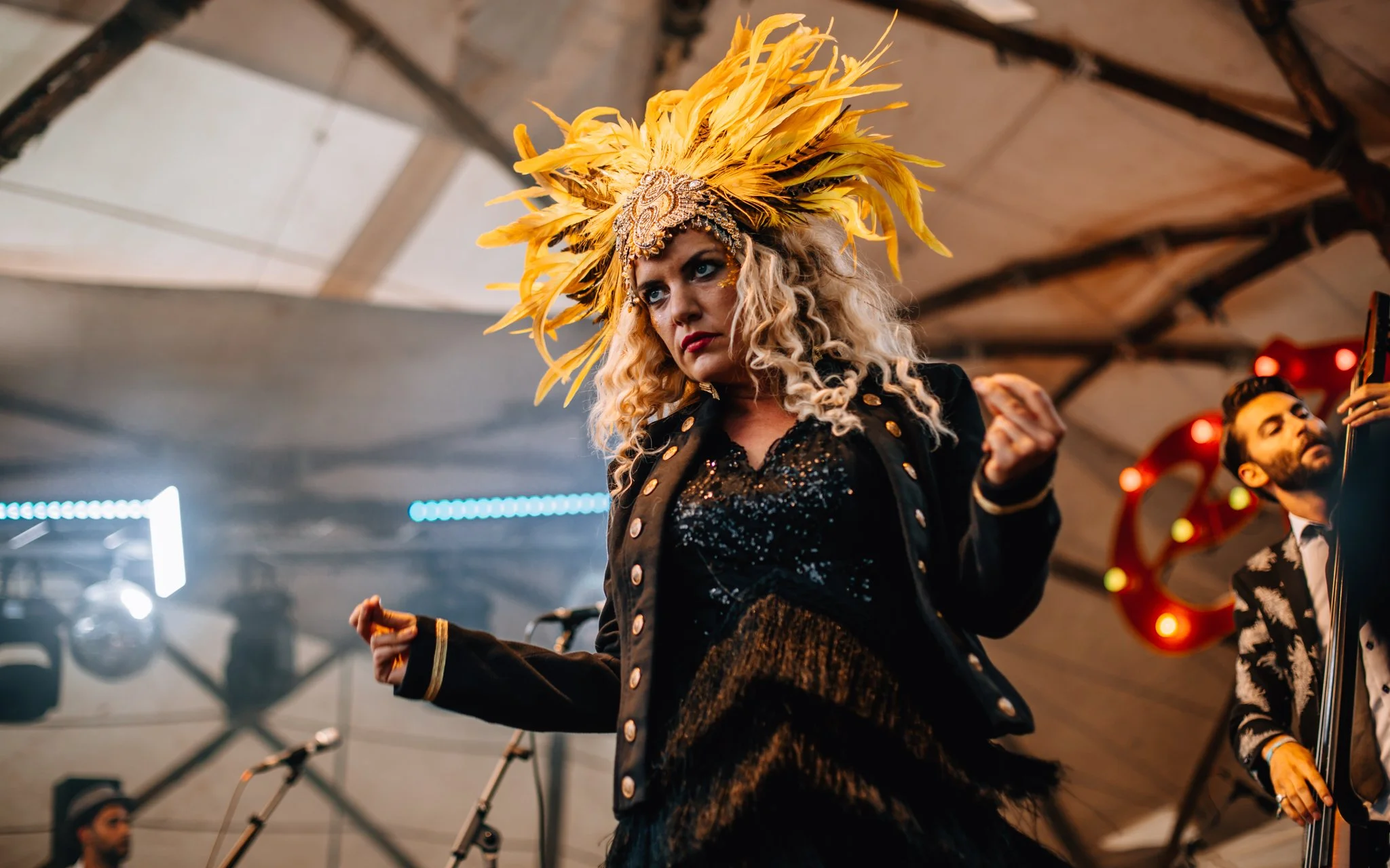  a singer dances on stage at Eden music festival in Scotland