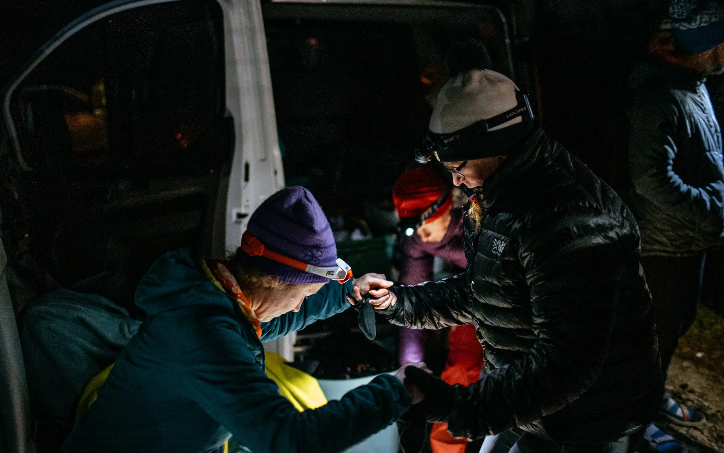  fell runners with head torch on