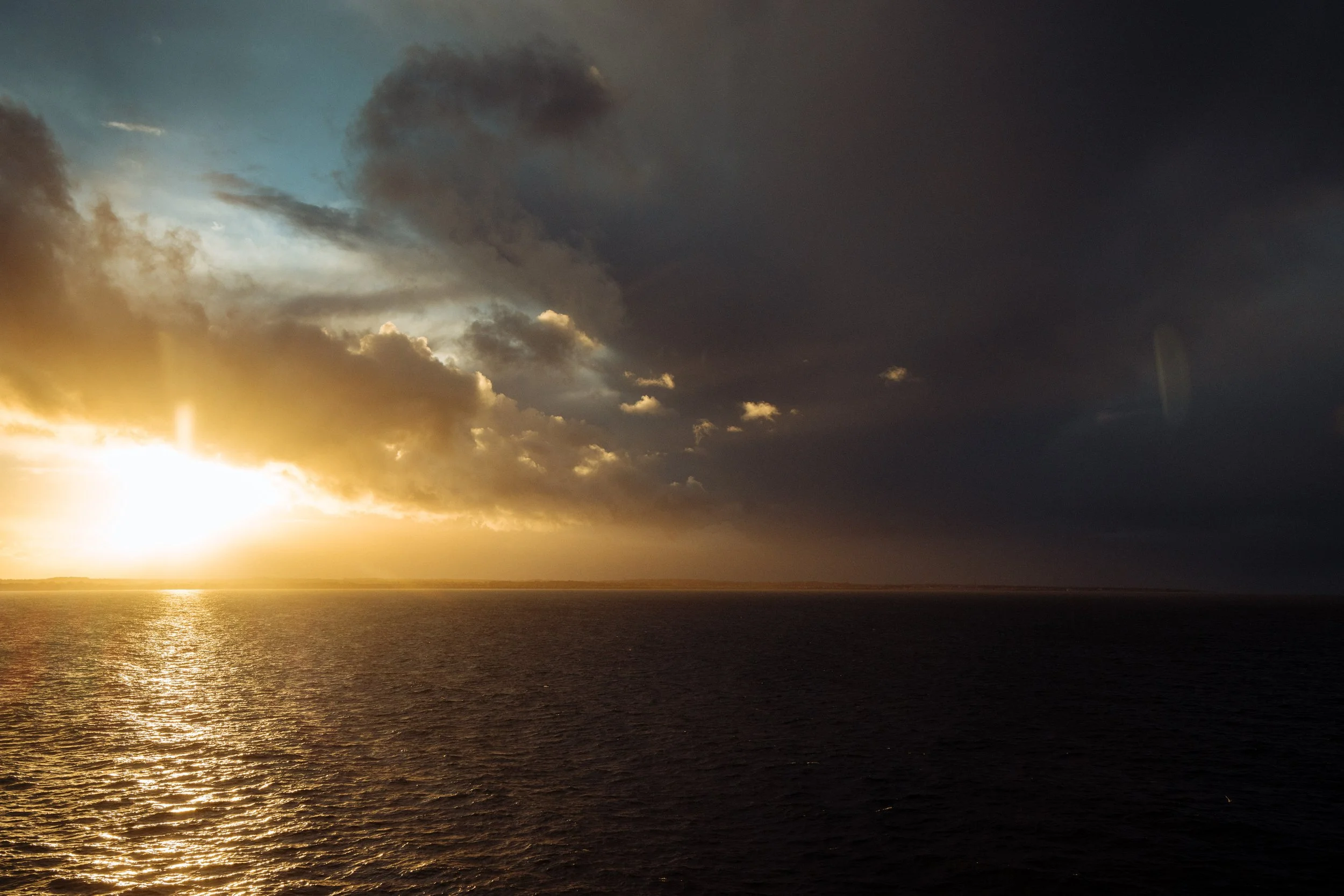 sunlight comes through a storm front on the English Channel