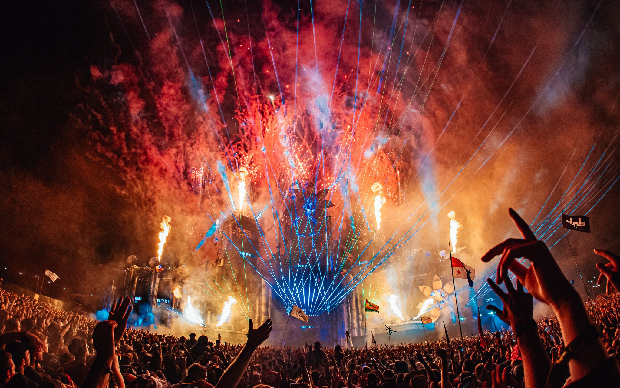 Music festival crowd with hands in the air, boomtown fair