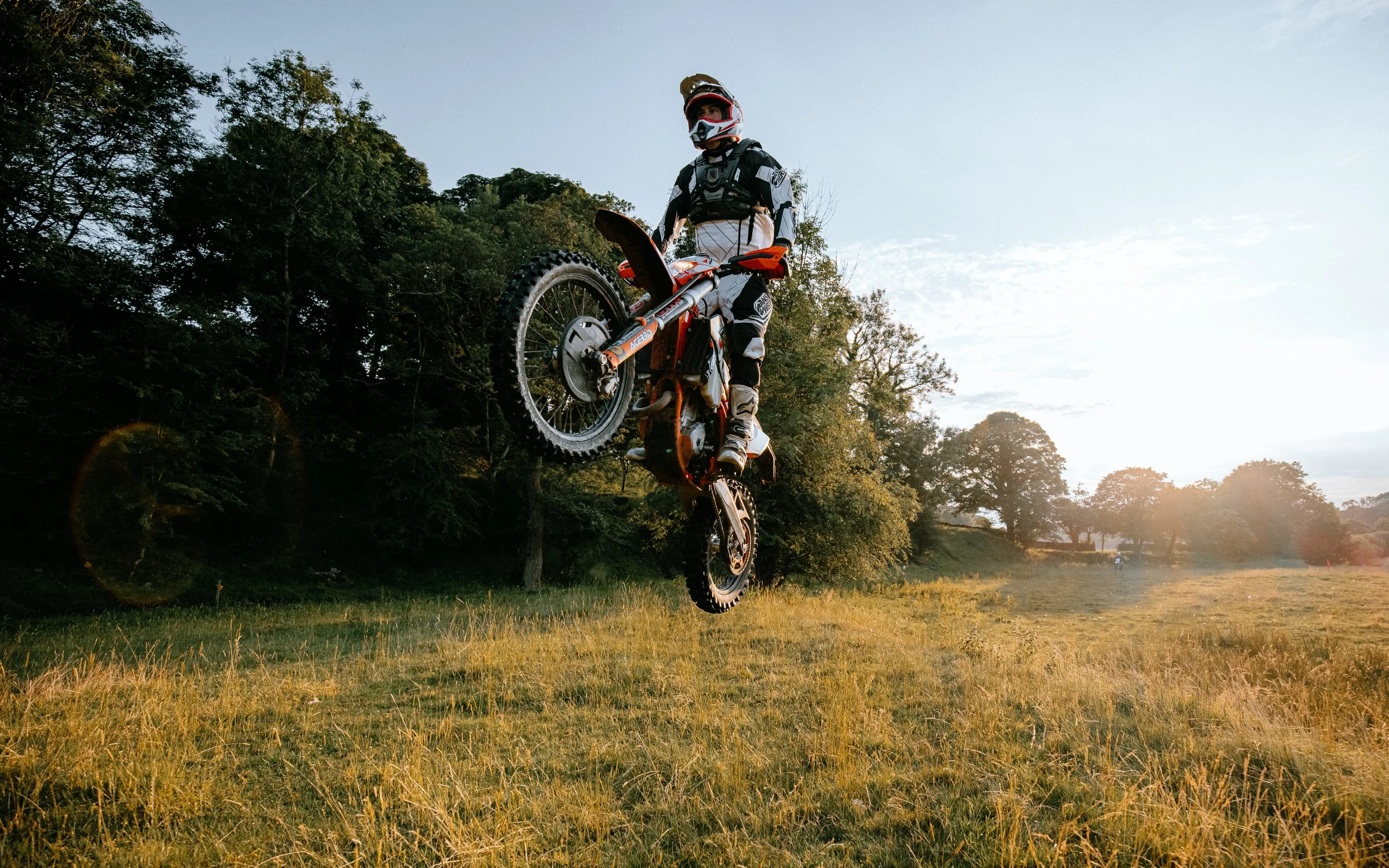  motocross, riders, do jumps in sunset