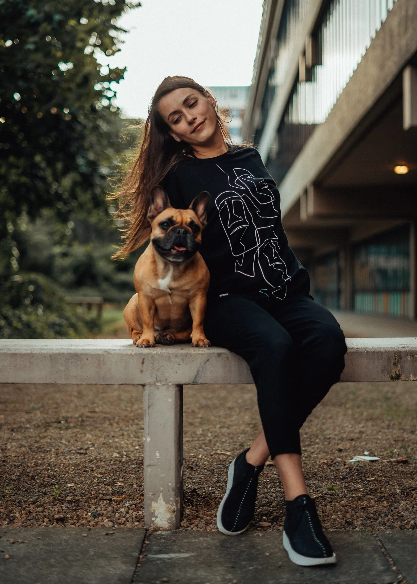Female model poses with dog