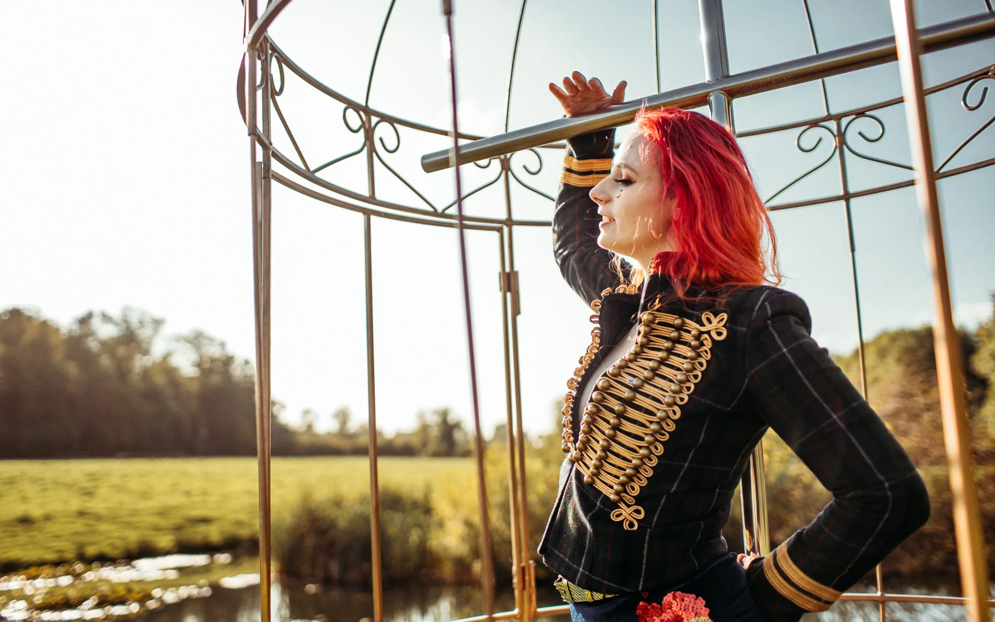 Performer poses in birdcage