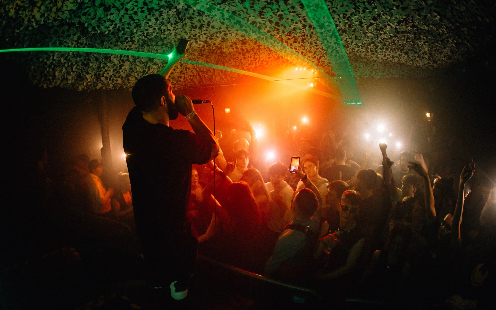  MC with crowd lights in the air